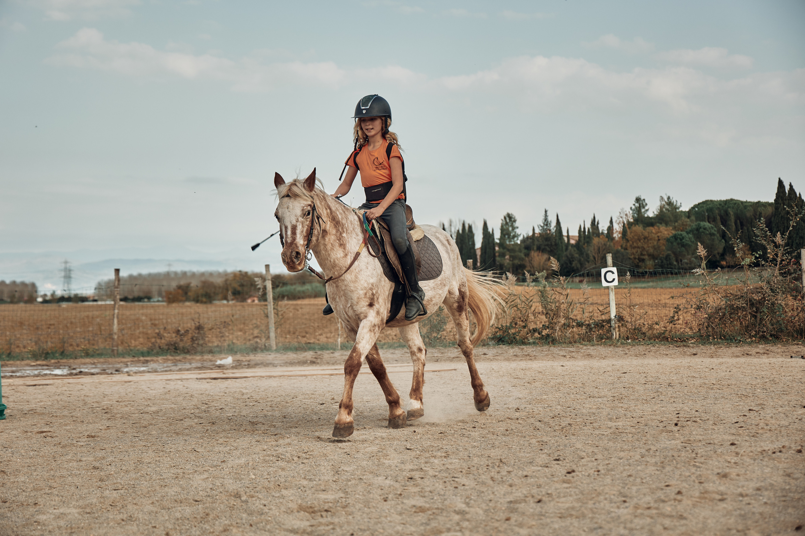 Reportage di bambini e pony. Fotografo di famiglie e ritrattista in Italia (Toscana)