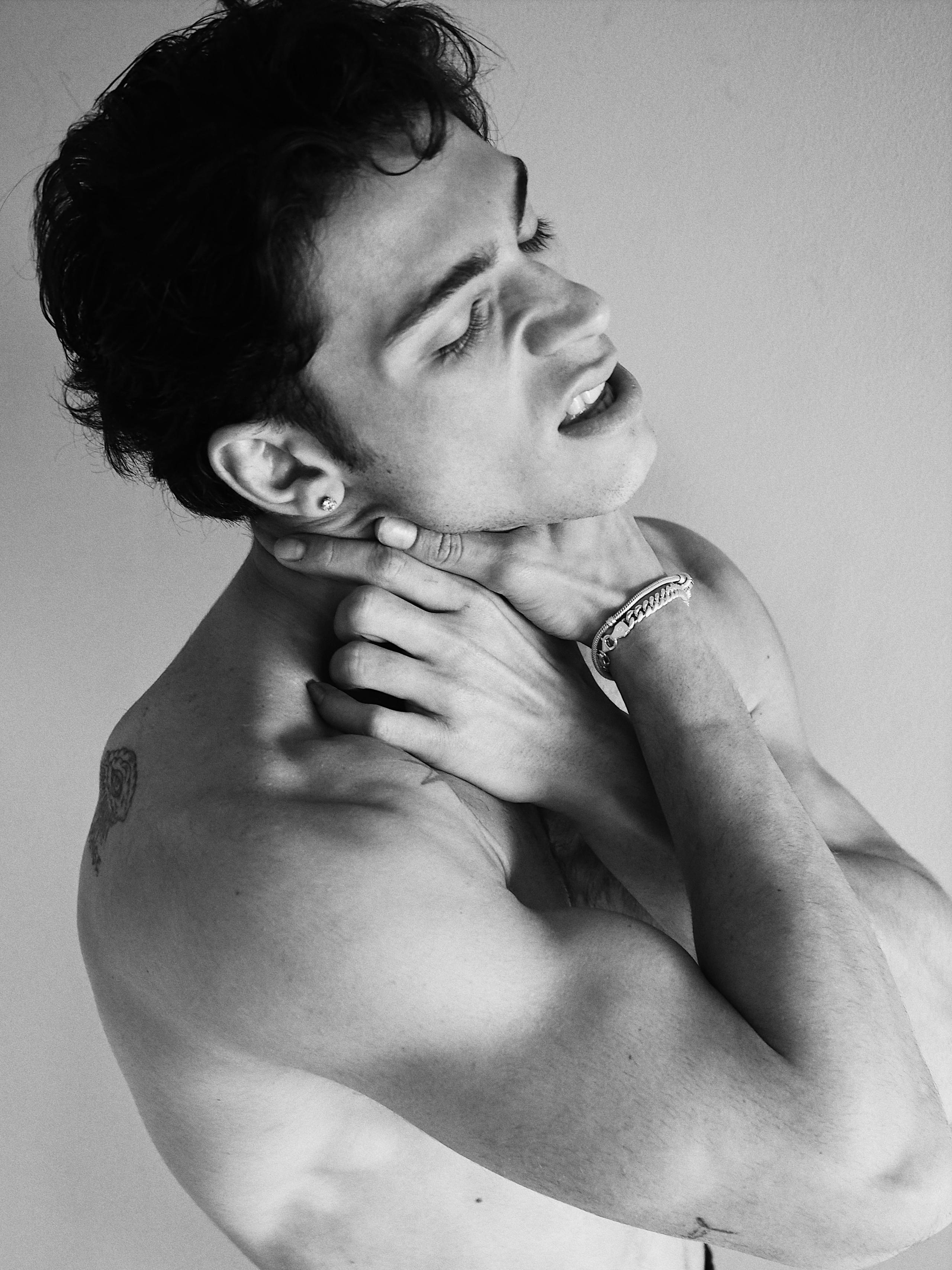 Black and white male artistic nude portrait with emotional pose, editorial fashion photography, Sergio Maiis