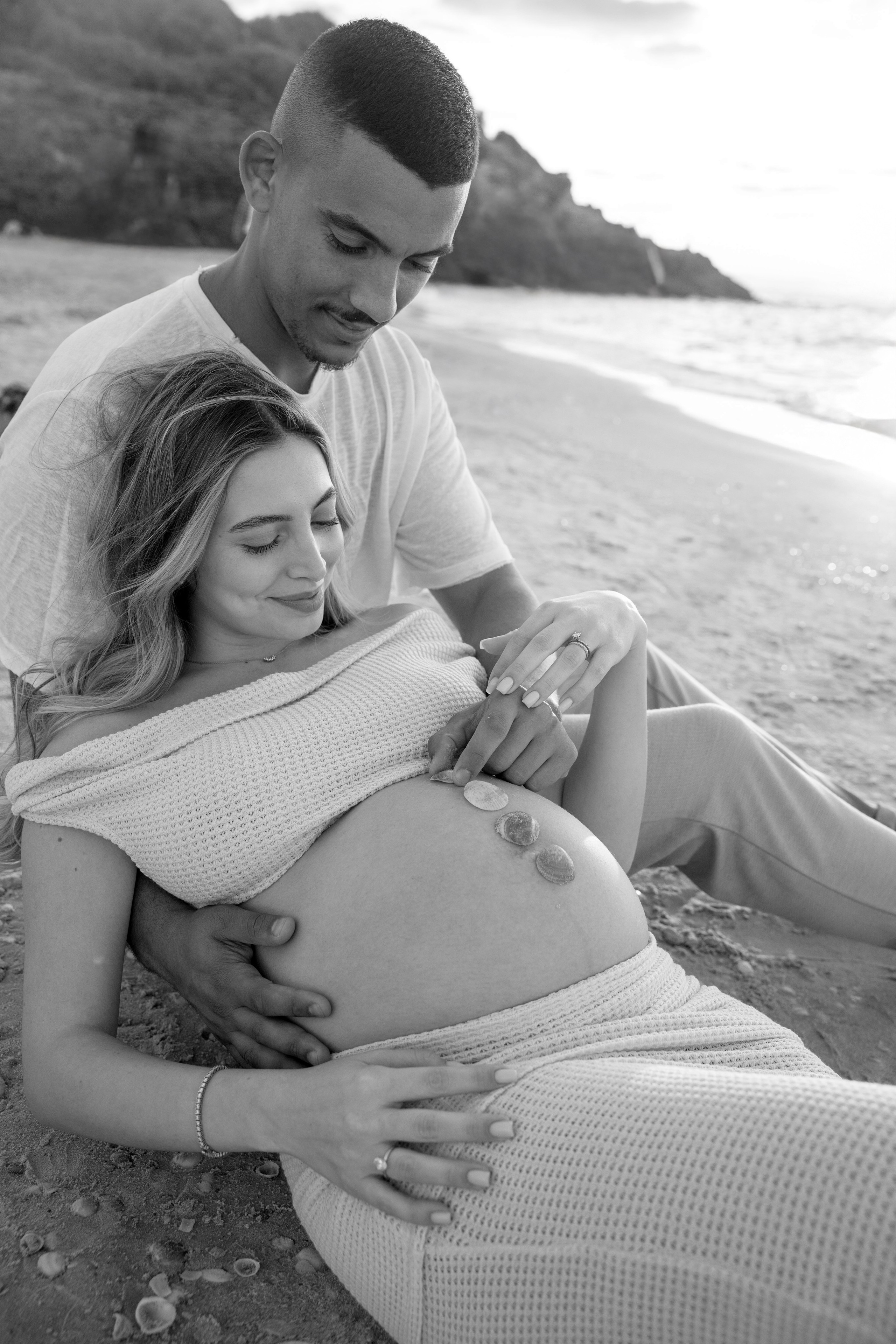 Pregnancy photoshoot near the sea. Wedding and family photographer