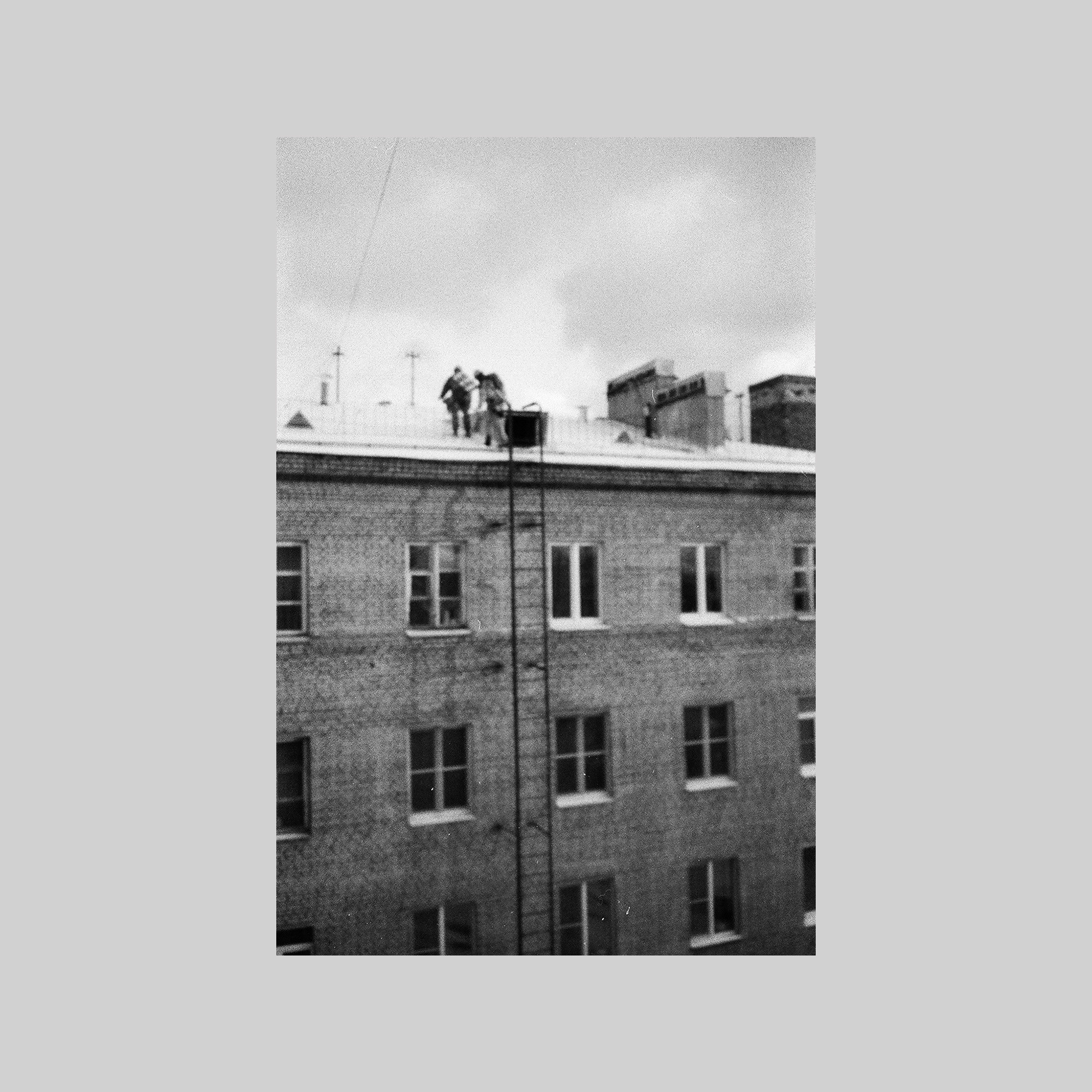 Two men on a roof (St Petersburg)