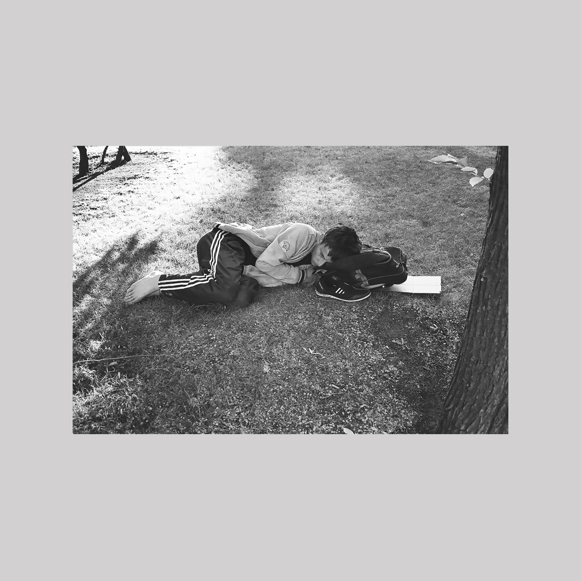 Man sleeping in a park (St Petersburg)