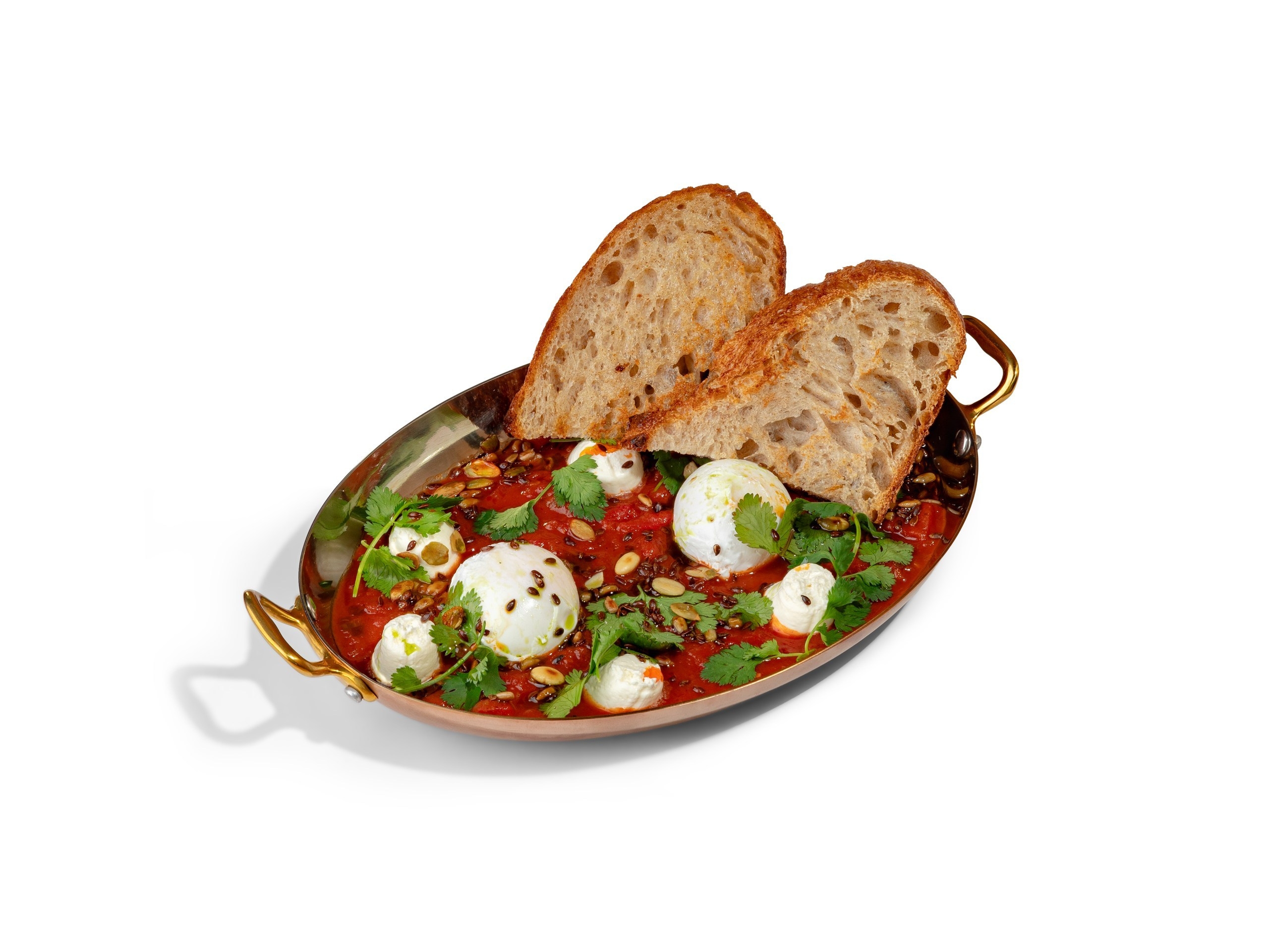 ШАКШУКА — 620₽.  Яйца - пашот в томатном соусе с добавлением репчатого лука, чеснока и сладкого перца. Украшена зеленым маслом, кинзой  и творожным сыром. 