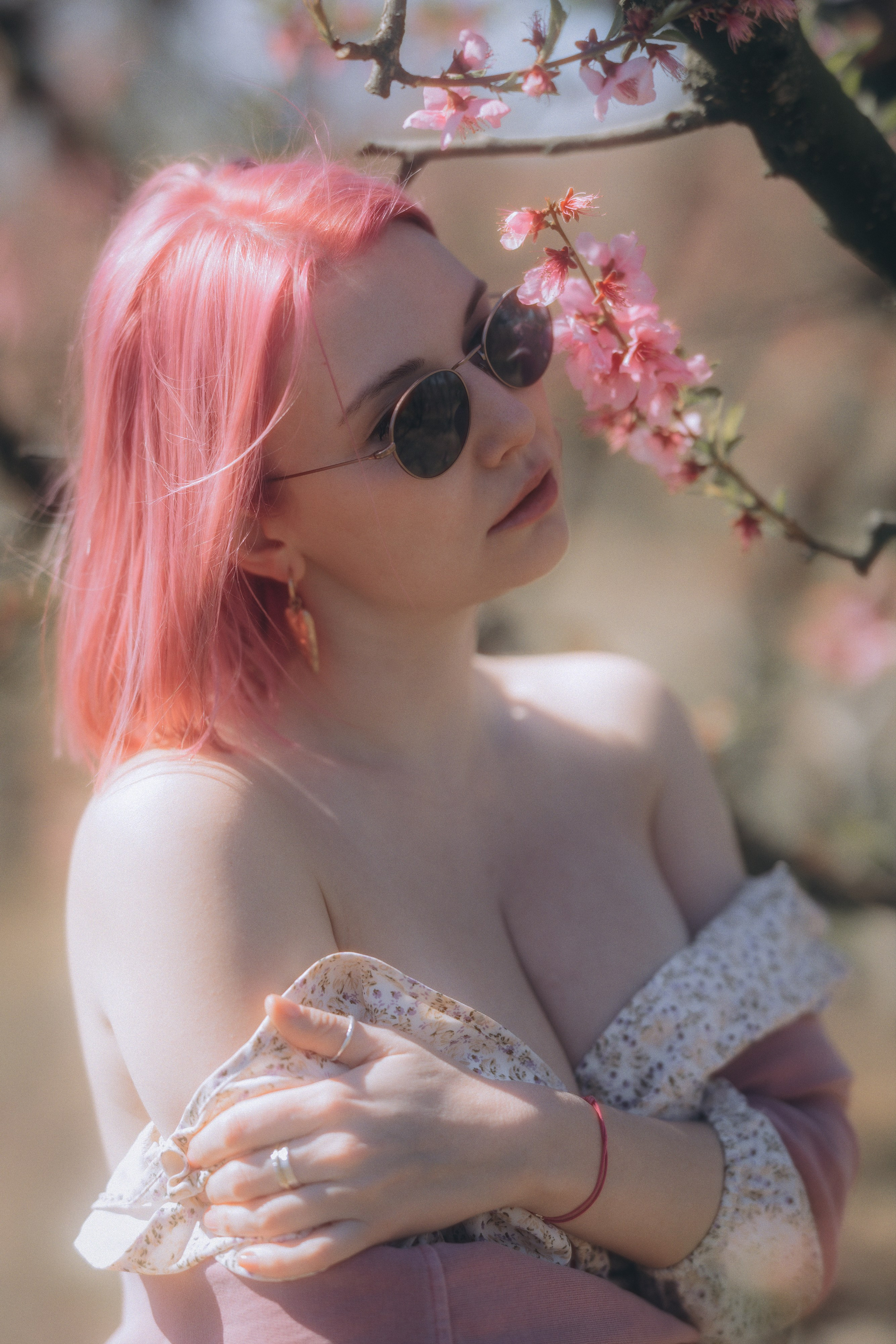 Woman in a white dress in a blooming garden in Barcelona, natural portrait session