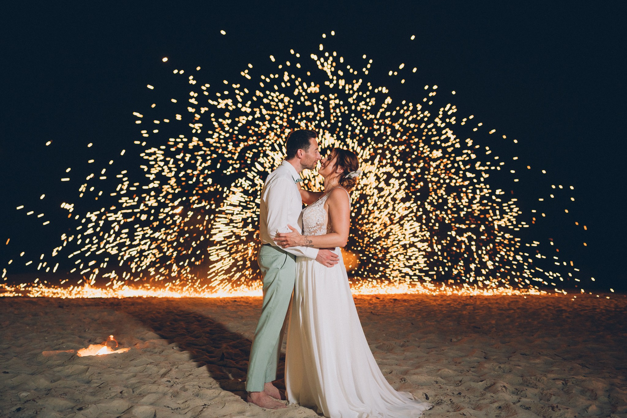 Professional fire dancers performing at a luxury wedding in Thailand