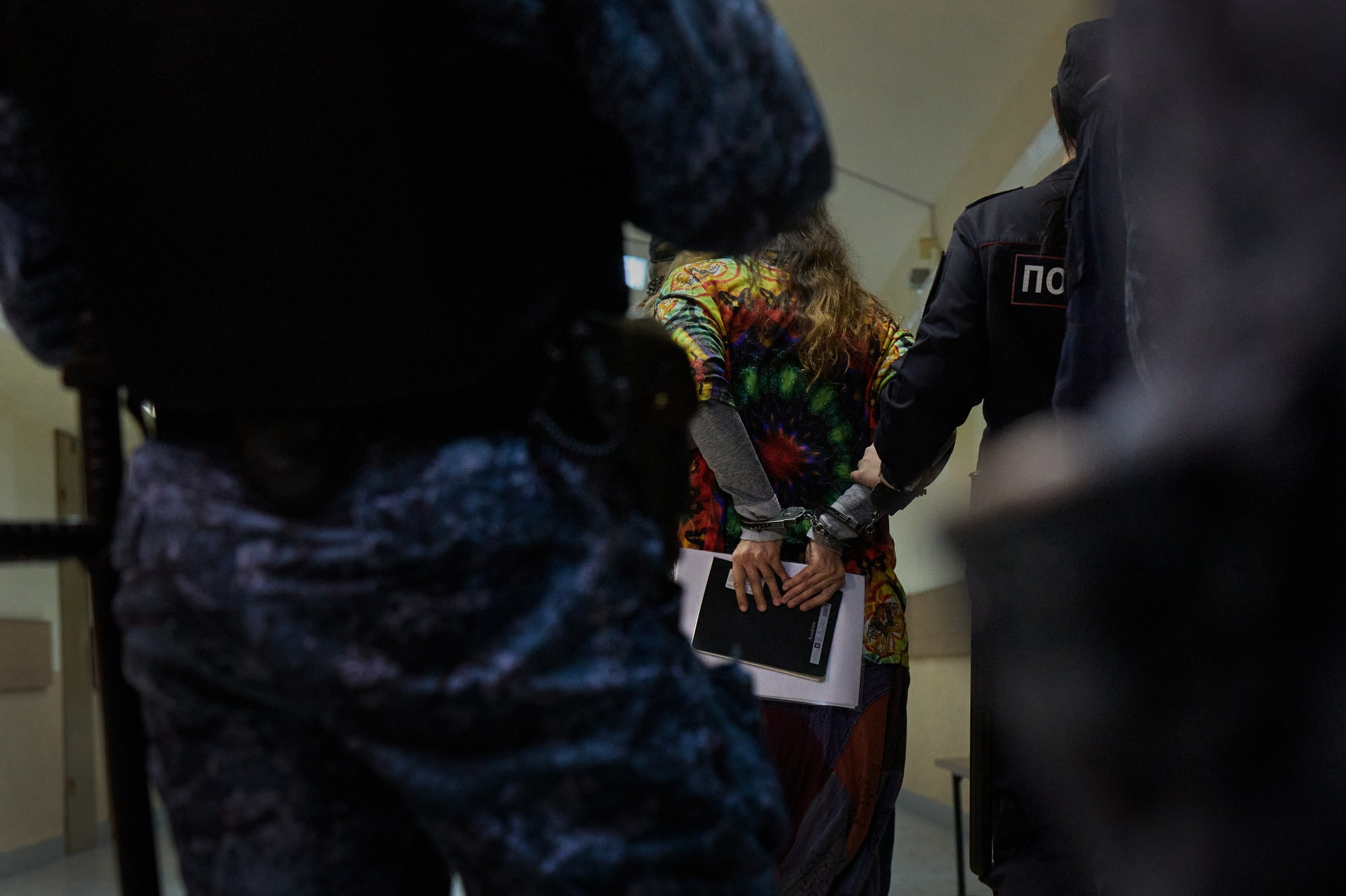 Sasha Skochilenko is led away in handcuffs from the courtroom after being sentenced to 7 years in prison. Sasha Skochilenko was released as part of a prisoner exchange between Russia, the USA, Germany, and Belarus on August 1, 2024. Two years and three months had passed since her arrest on April 11, 2022. She finally reunited with her girlfriend Sonia and her family.