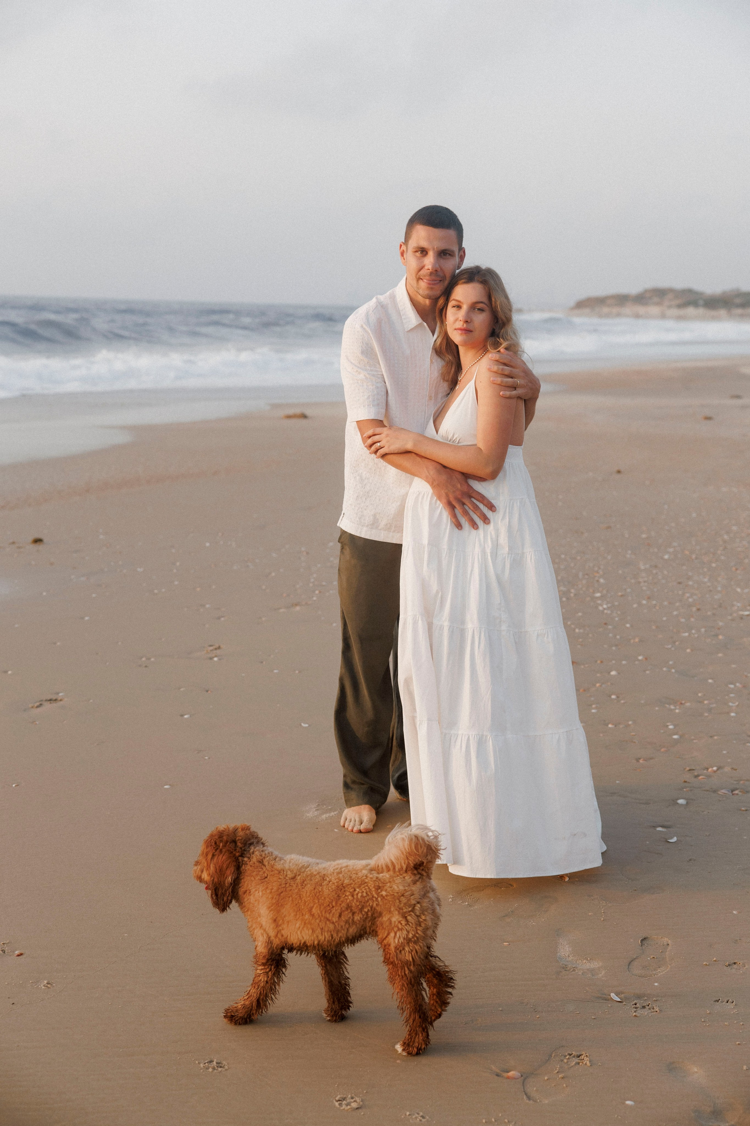 Pregnancy photoshoot near the sea (cloudy weather). Главная