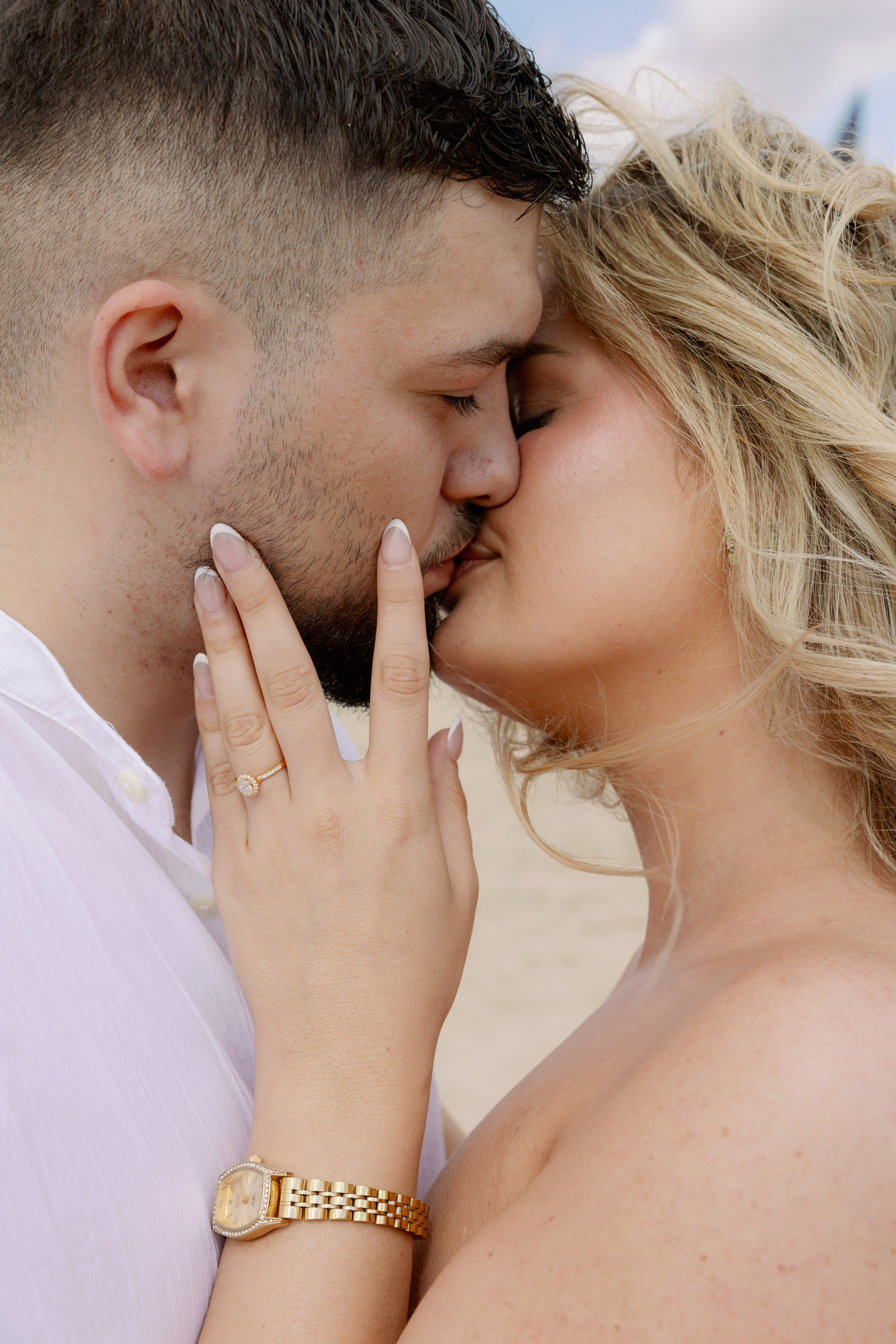 Couple celebrating their engagement with champagne in Barcelona