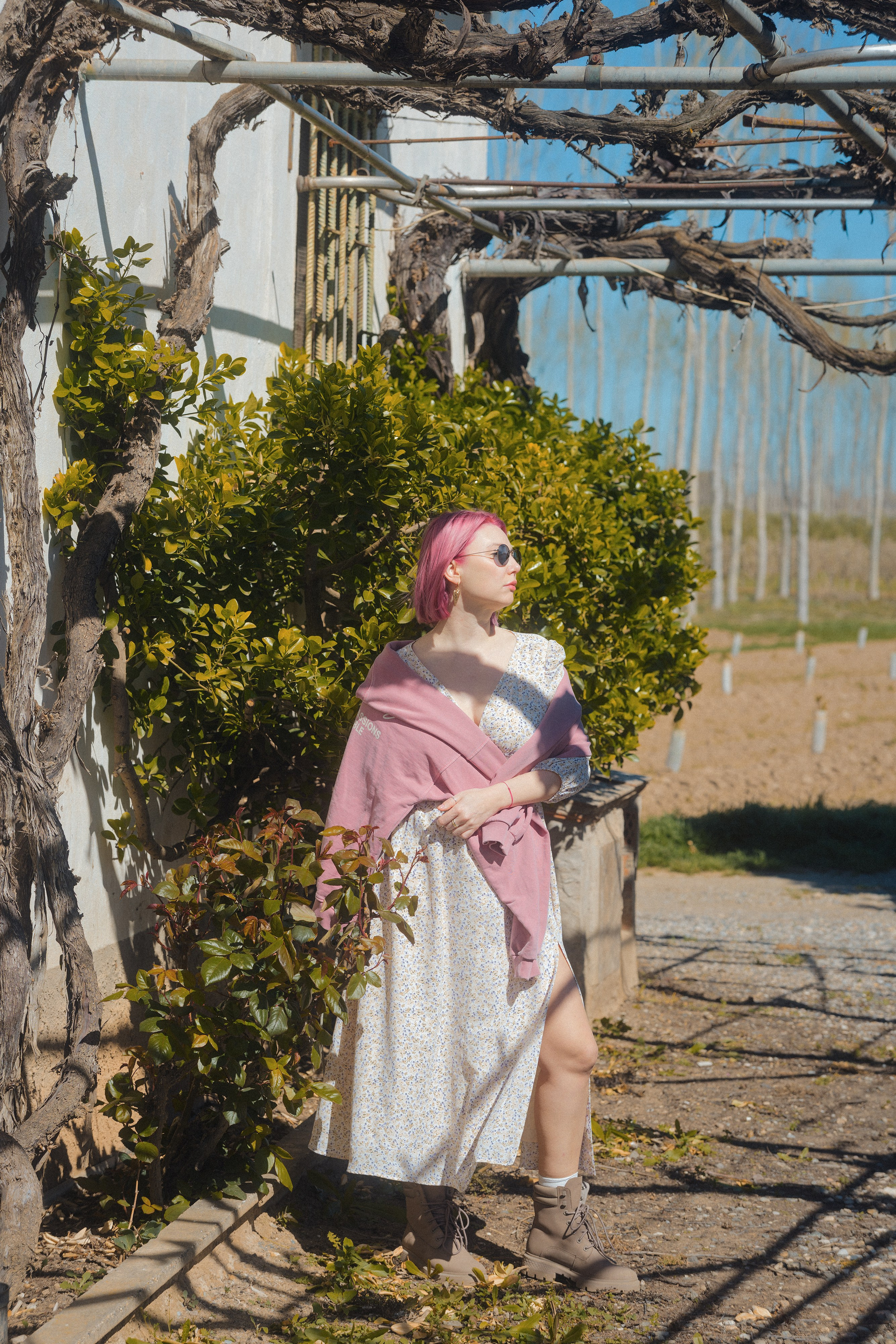 Woman posing in a floral garden in Barcelona, lifestyle portrait photoshoot