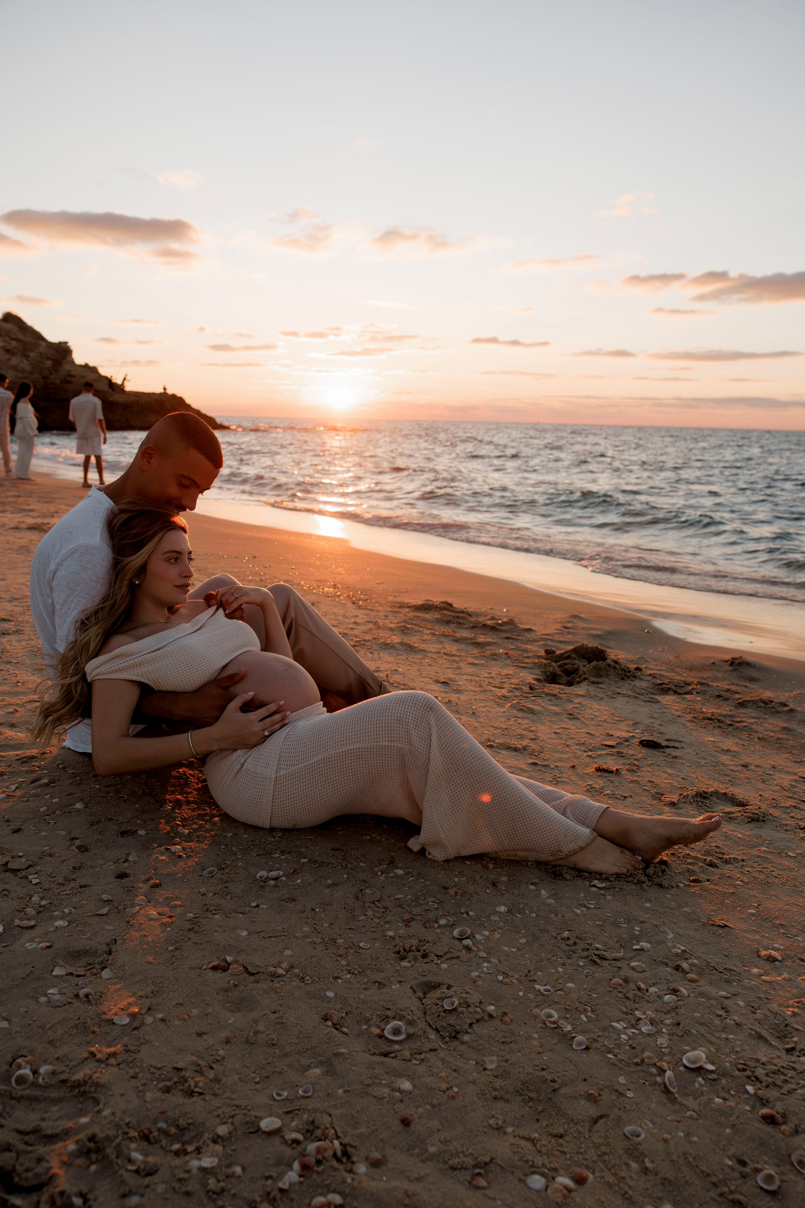 Pregnancy photoshoot near the sea. Wedding and family photographer