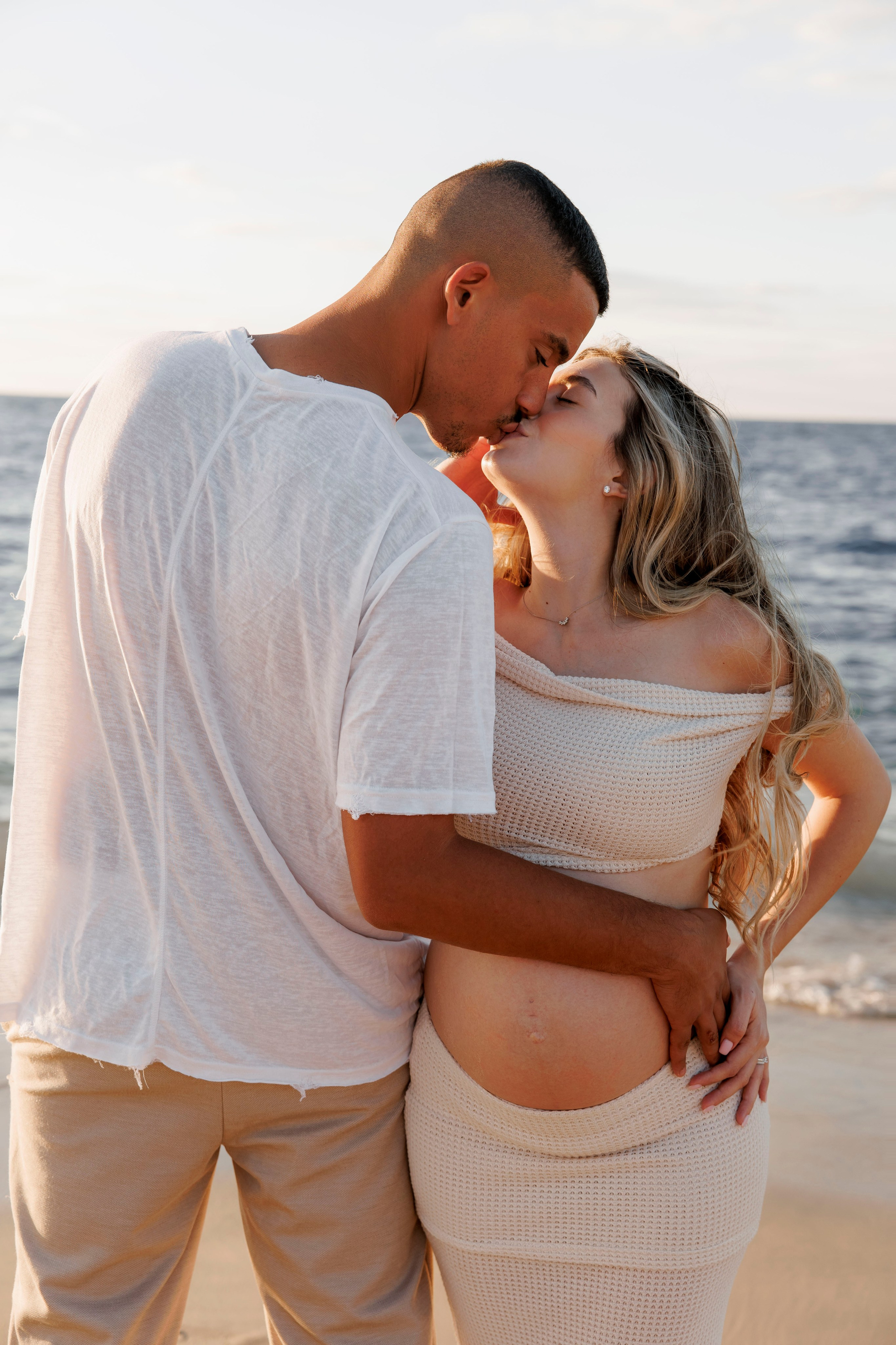 Pregnancy photoshoot near the sea. Wedding and family photographer