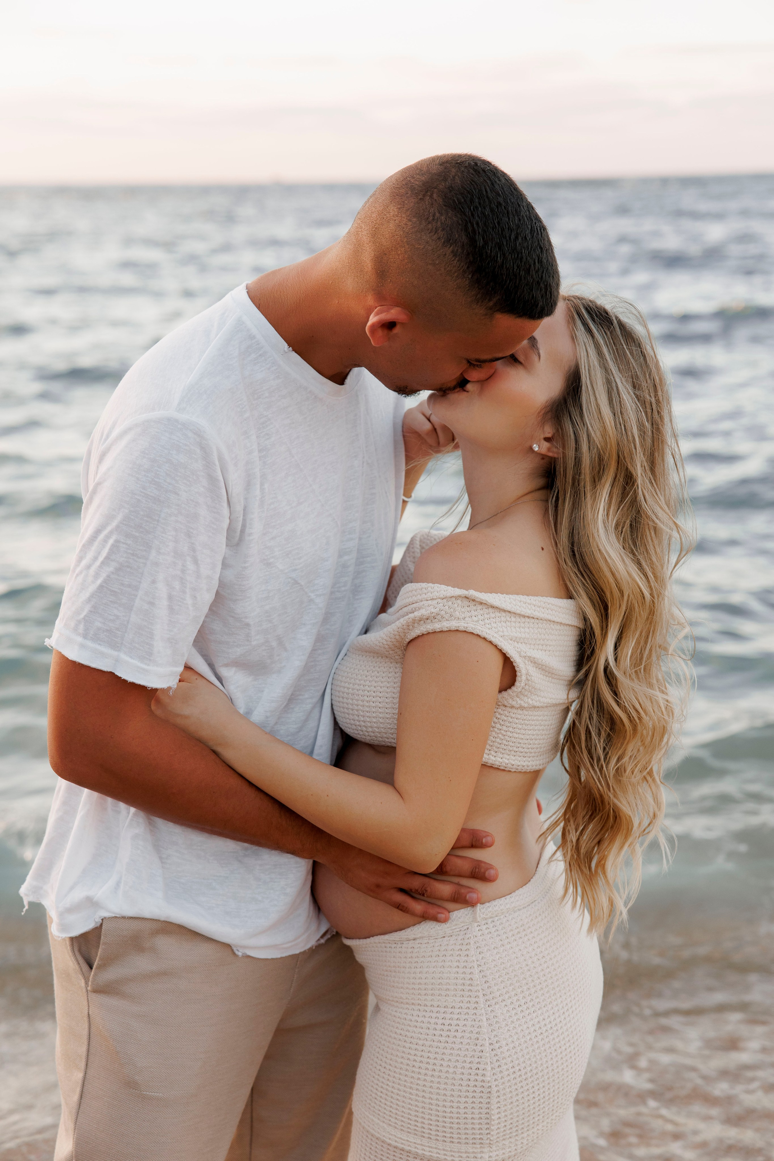Pregnancy photoshoot near the sea. Wedding and family photographer
