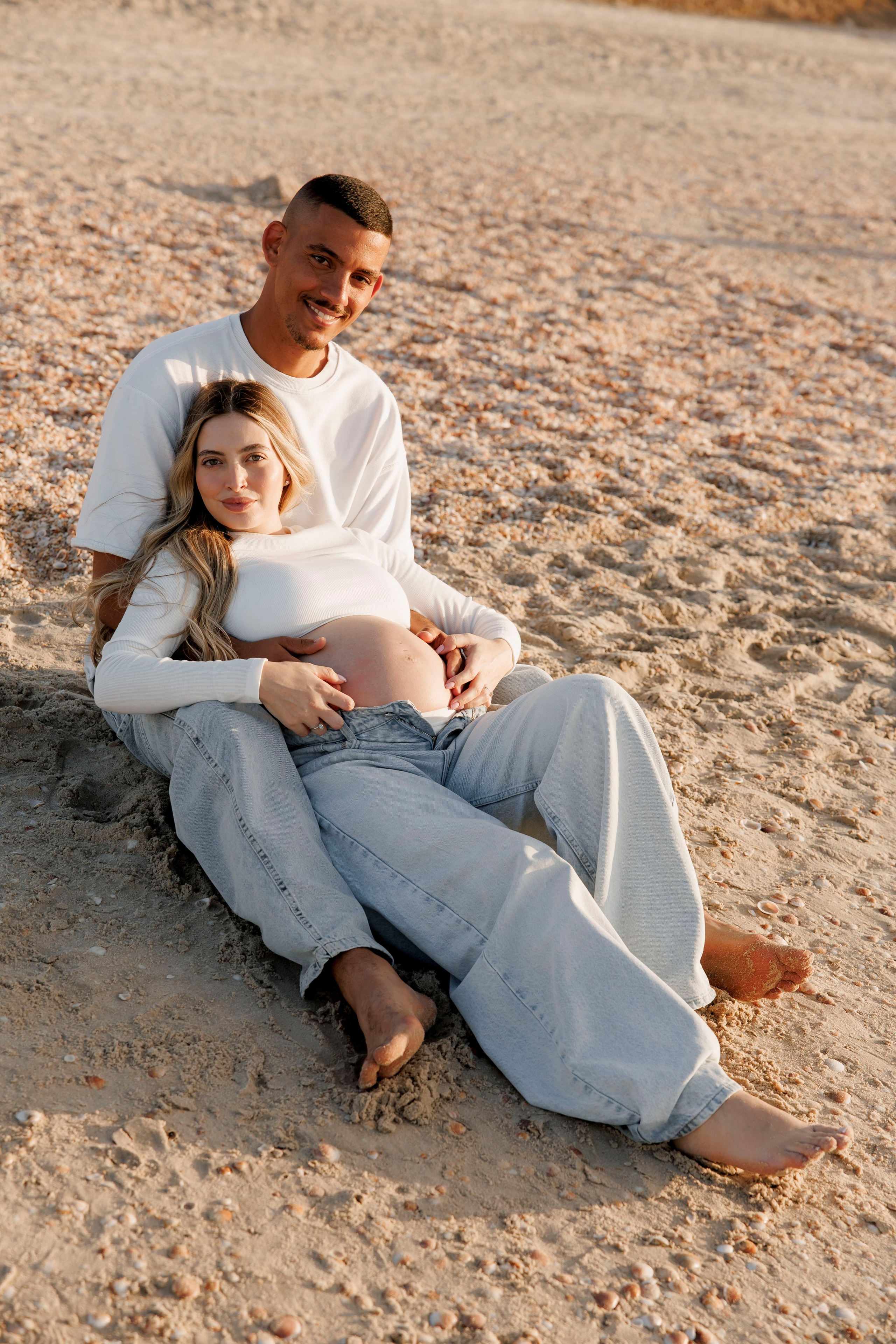 Pregnancy photoshoot near the sea. Wedding and family photographer