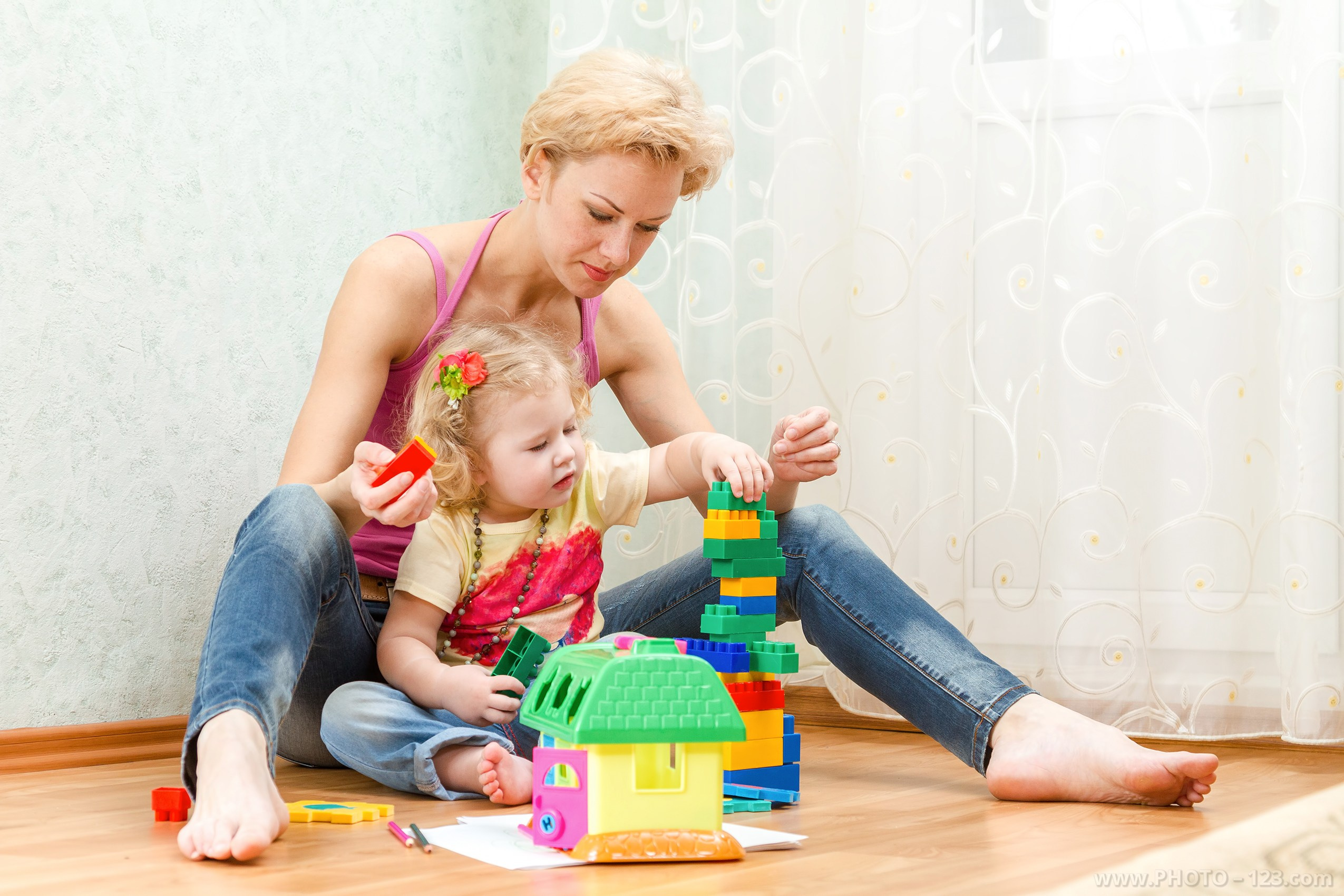 Mother playing with her toddler at home, lifestyle family portrait by a professional photographer in Vietnam, Phu Quoc