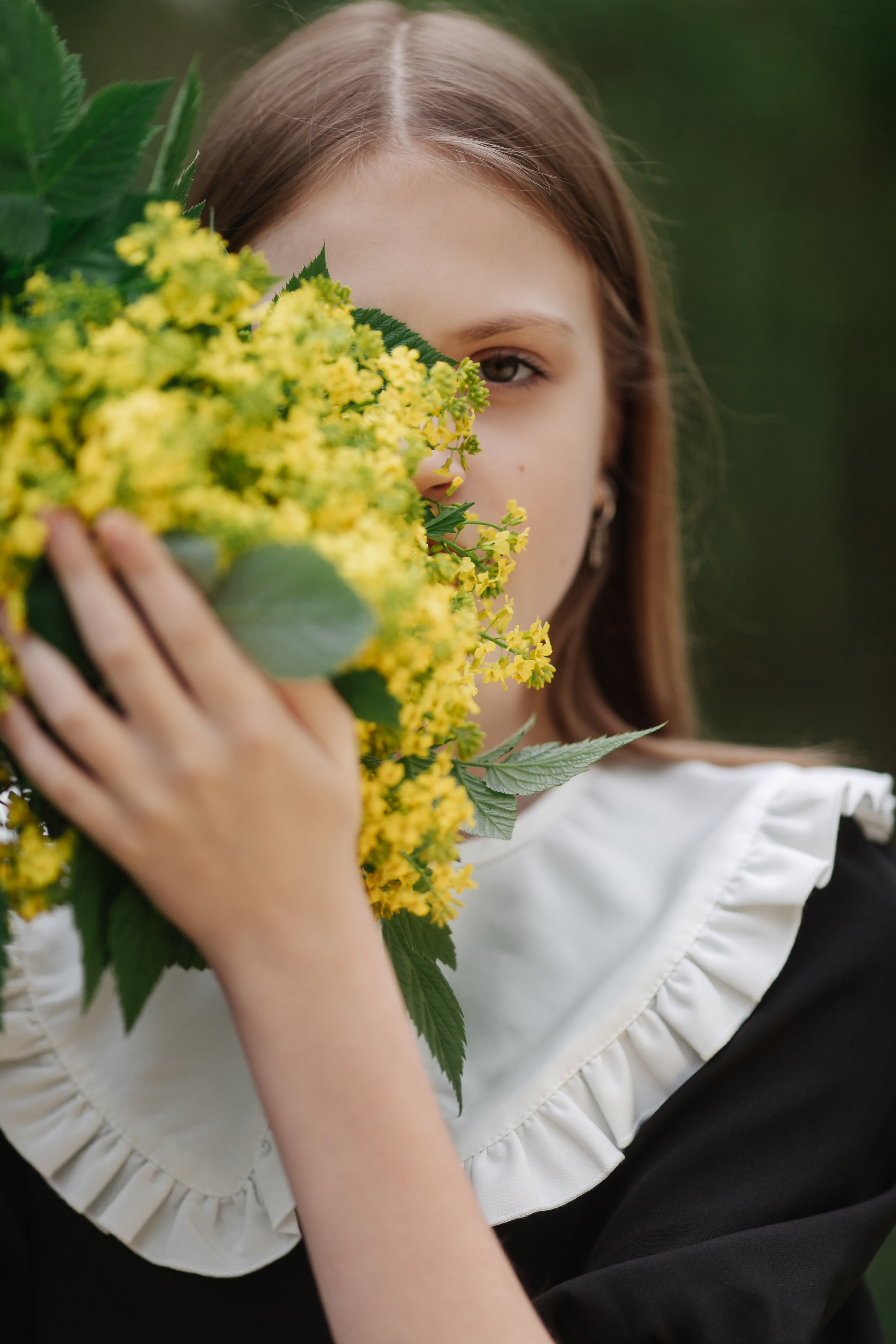 Kristina Sher with yellow flowers.
