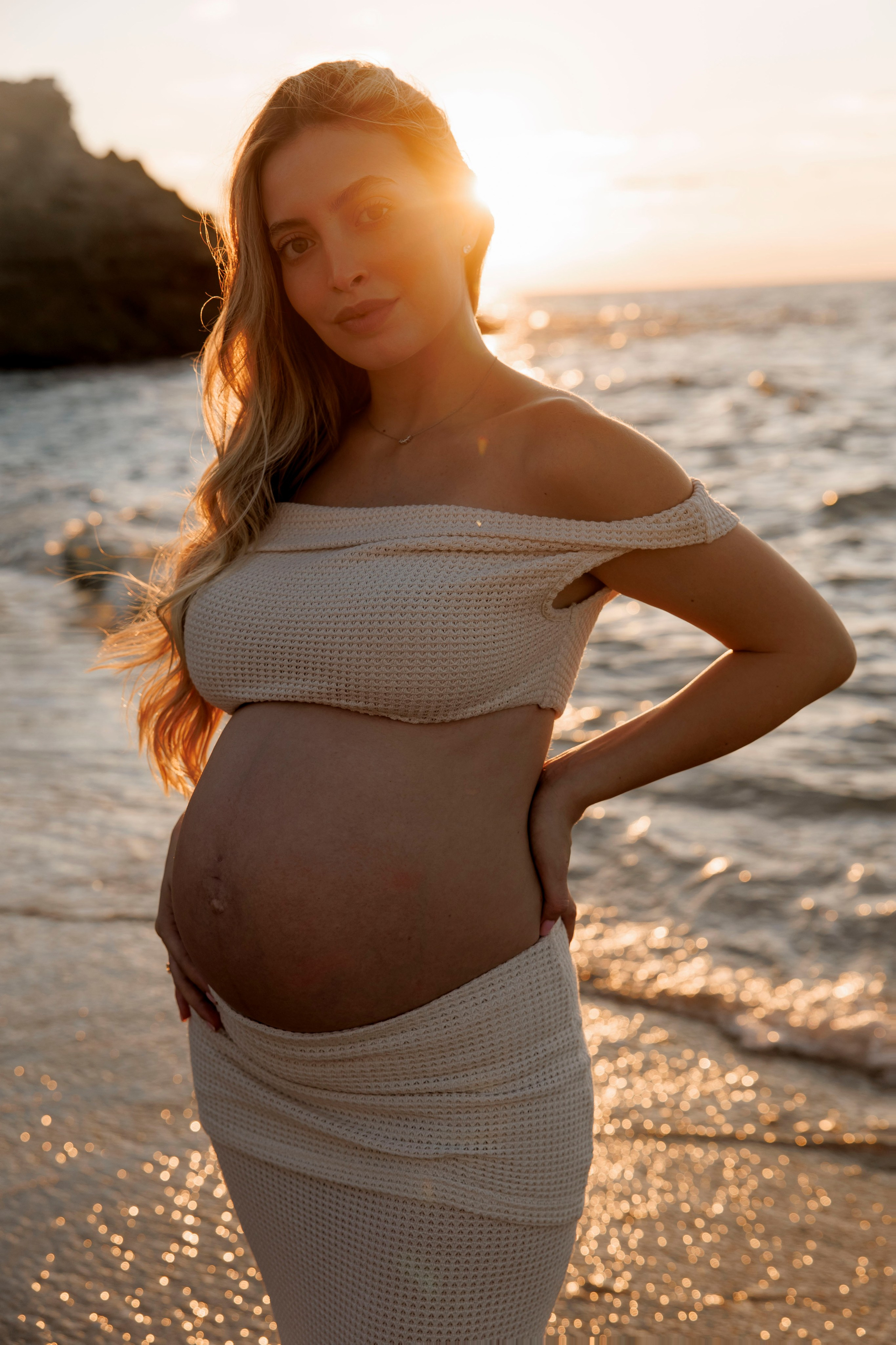Pregnancy photoshoot near the sea. Wedding and family photographer