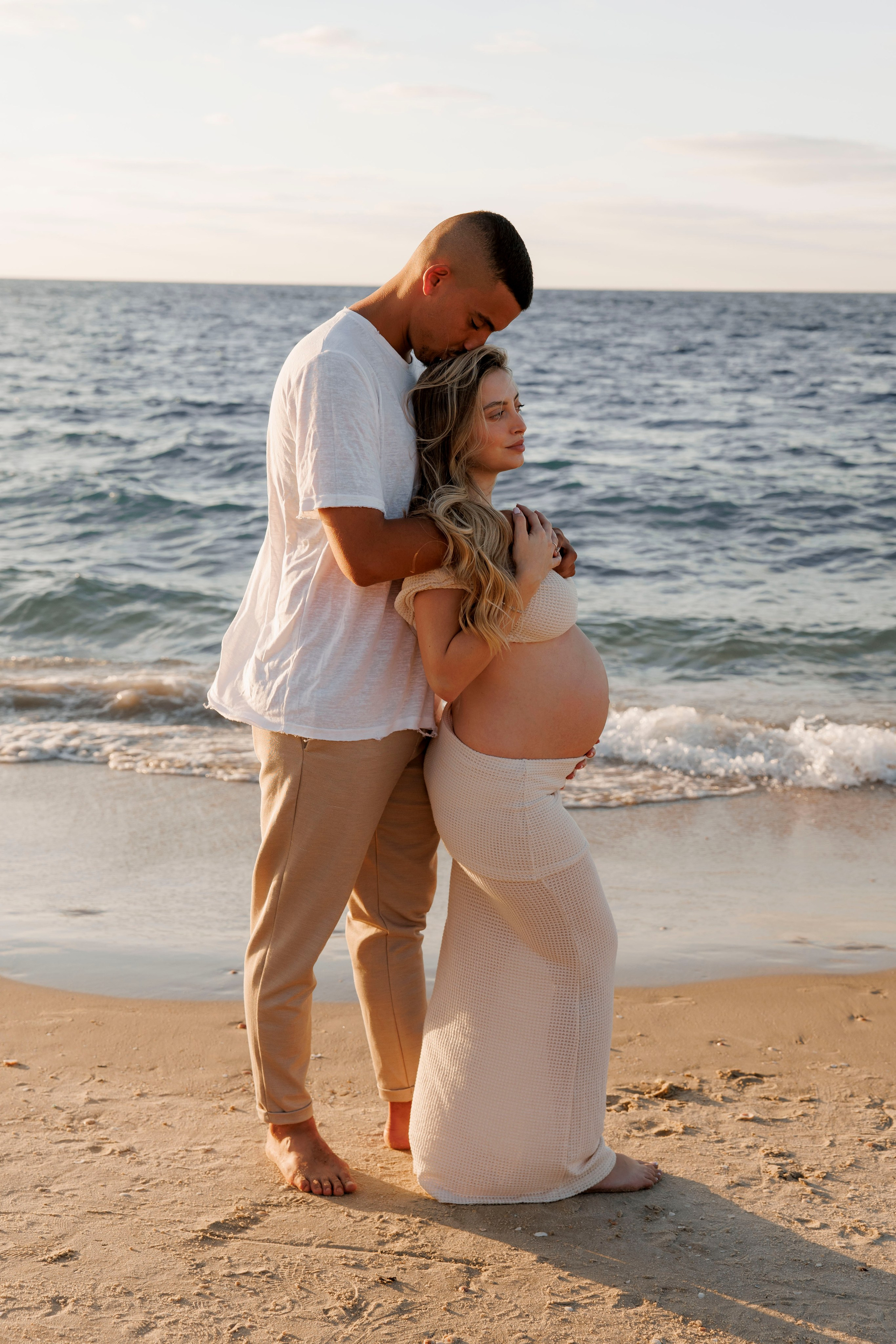 Pregnancy photoshoot near the sea. Wedding and family photographer