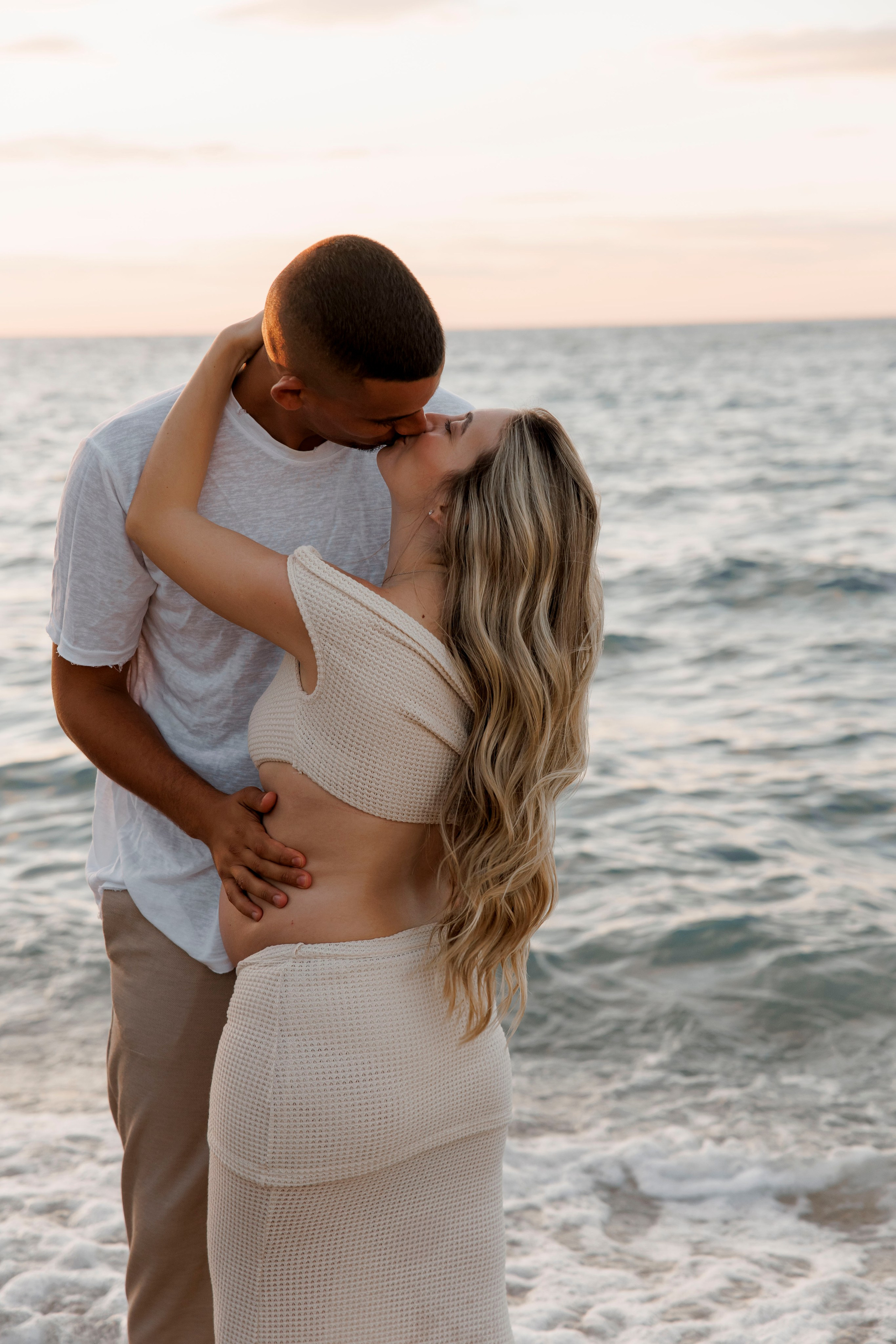 Pregnancy photoshoot near the sea. Wedding and family photographer