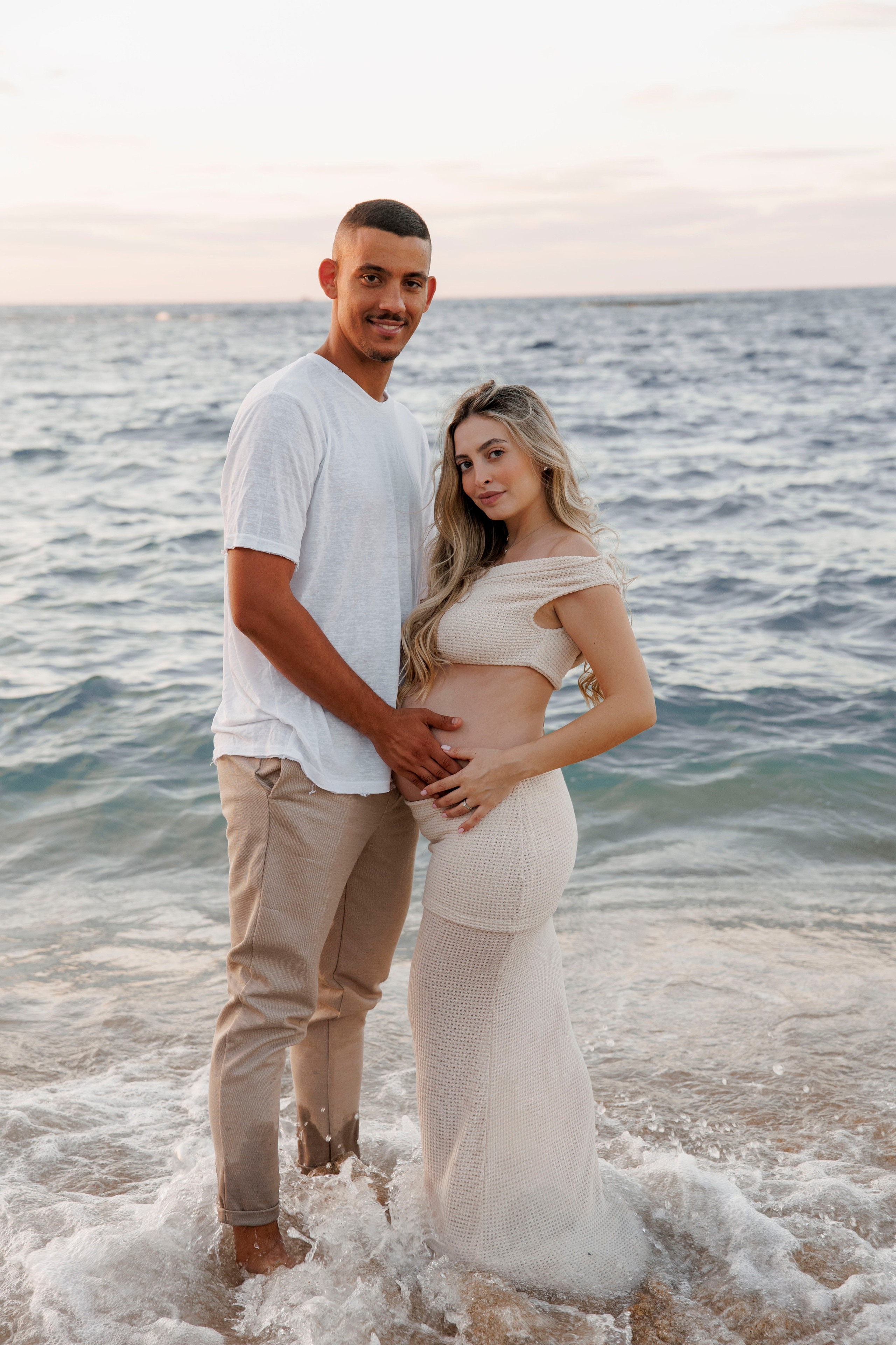 Pregnancy photoshoot near the sea. Wedding and family photographer