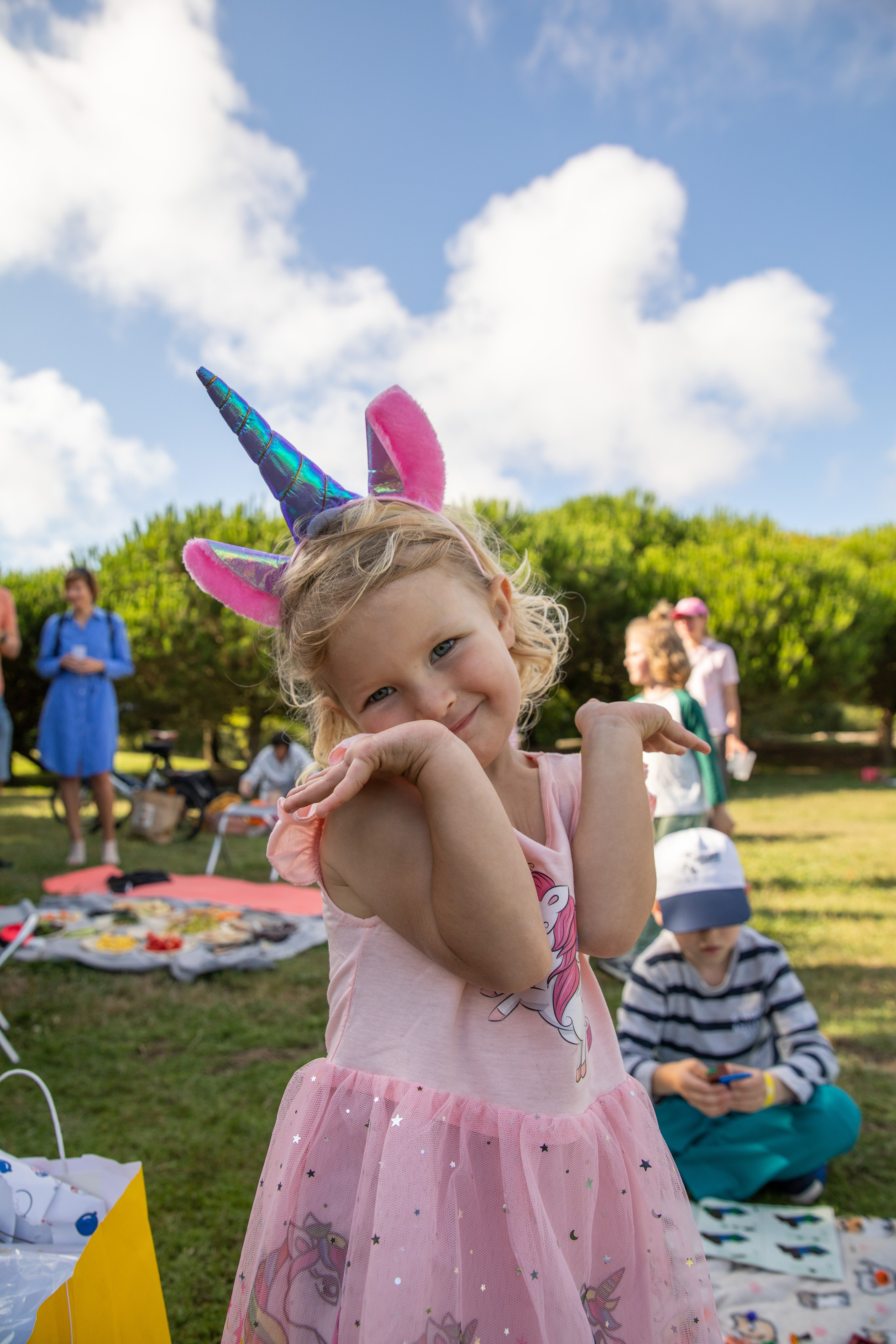 Children enjoying a birthday photo shoot in the park with games and soap bubbles. Children playing and having fun in the park. Games and soap bubbles. Birthday photo shoot