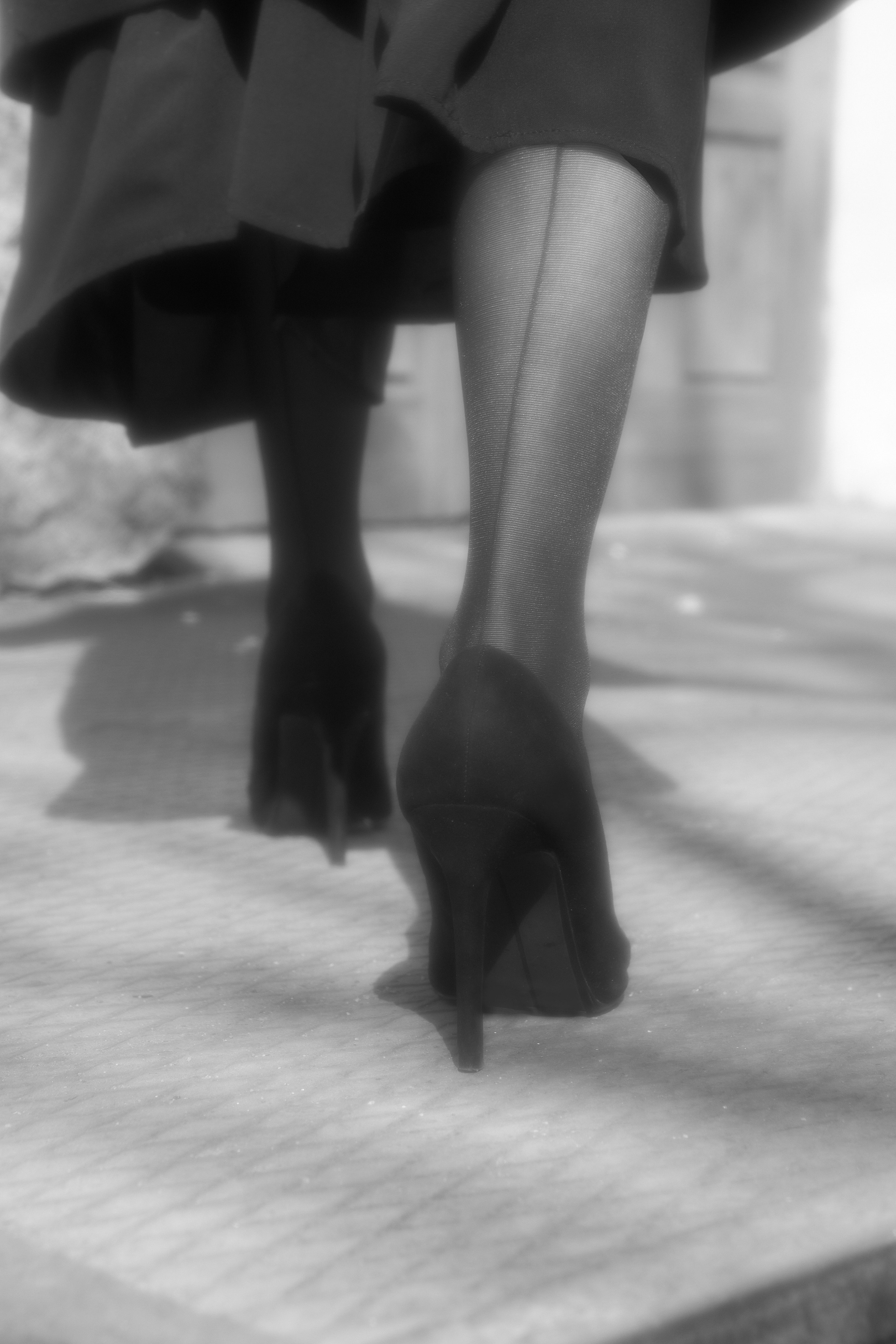 Black coat walking. Fashion Photographer Oxana Chernomorets