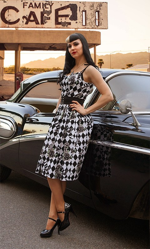 Pin up pretty girl near old car