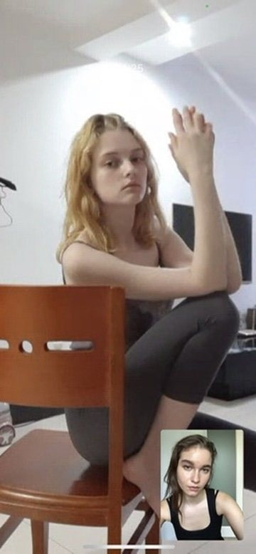 Anasta coaching a participant during an online posing workshop