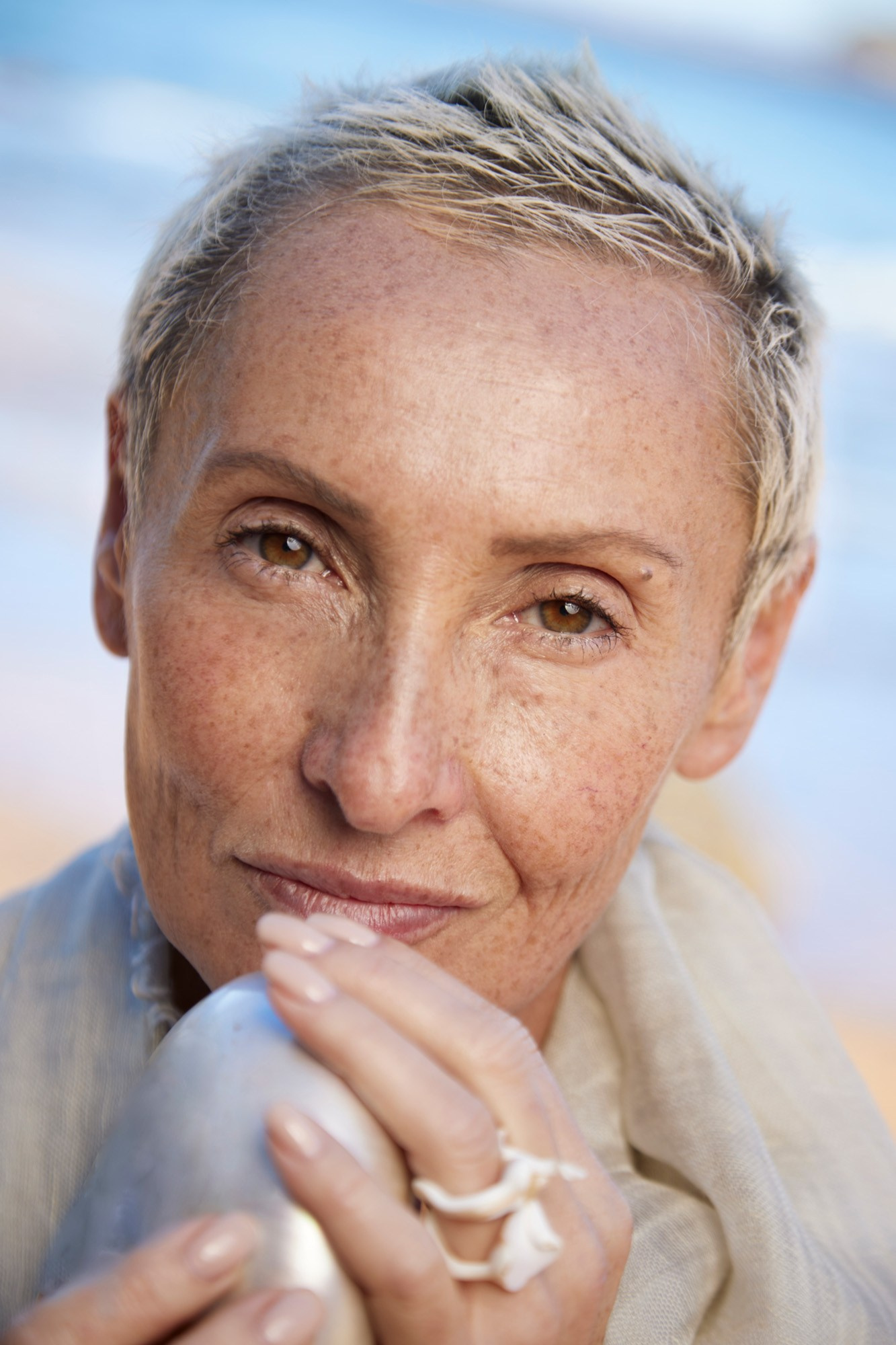 Close-up portrait of model Lenna Holt with short blonde hair and natural beauty styling.