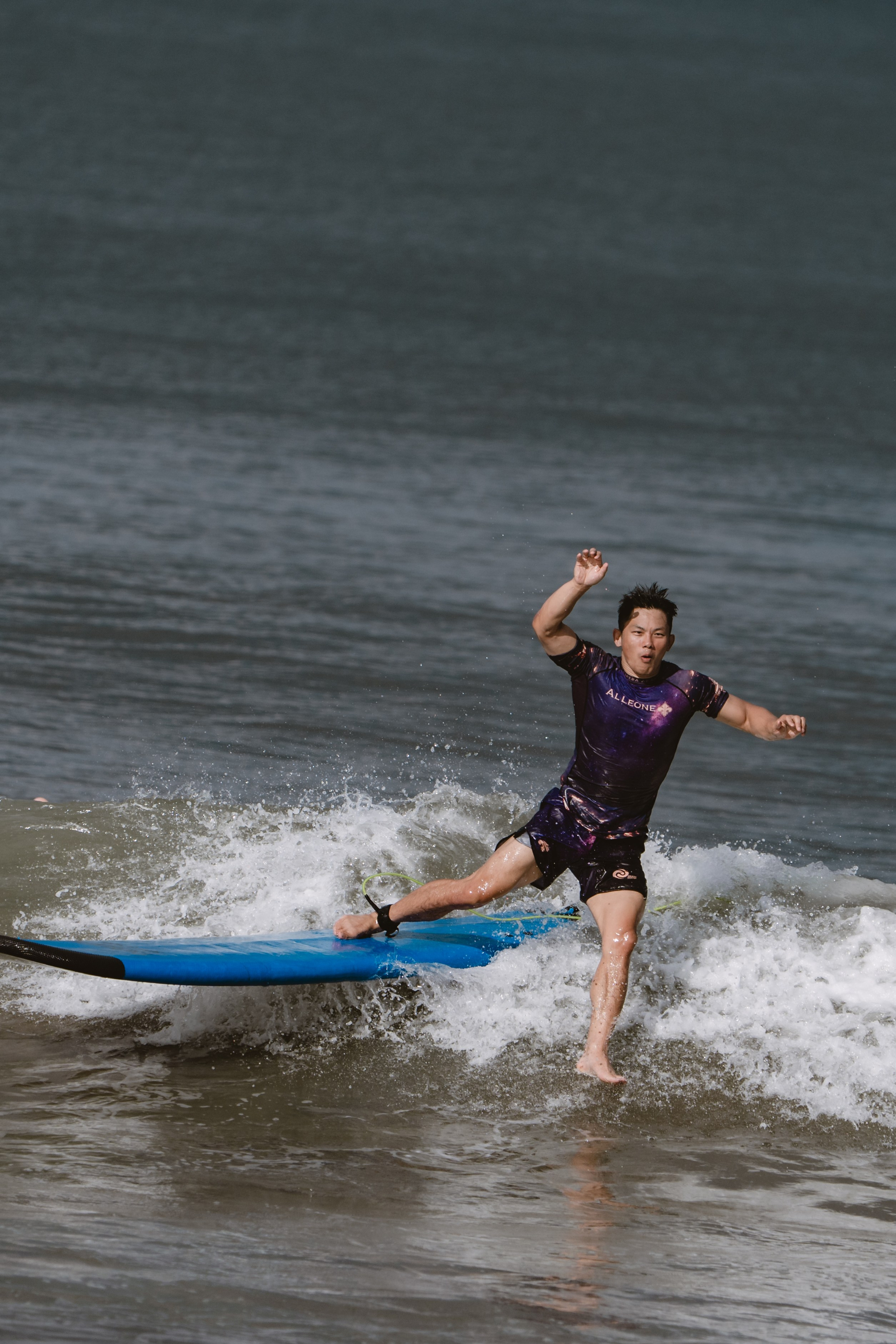 Mixed martial artists having fun surfing at the ocean in between training sessions. Сергей Зворыгин