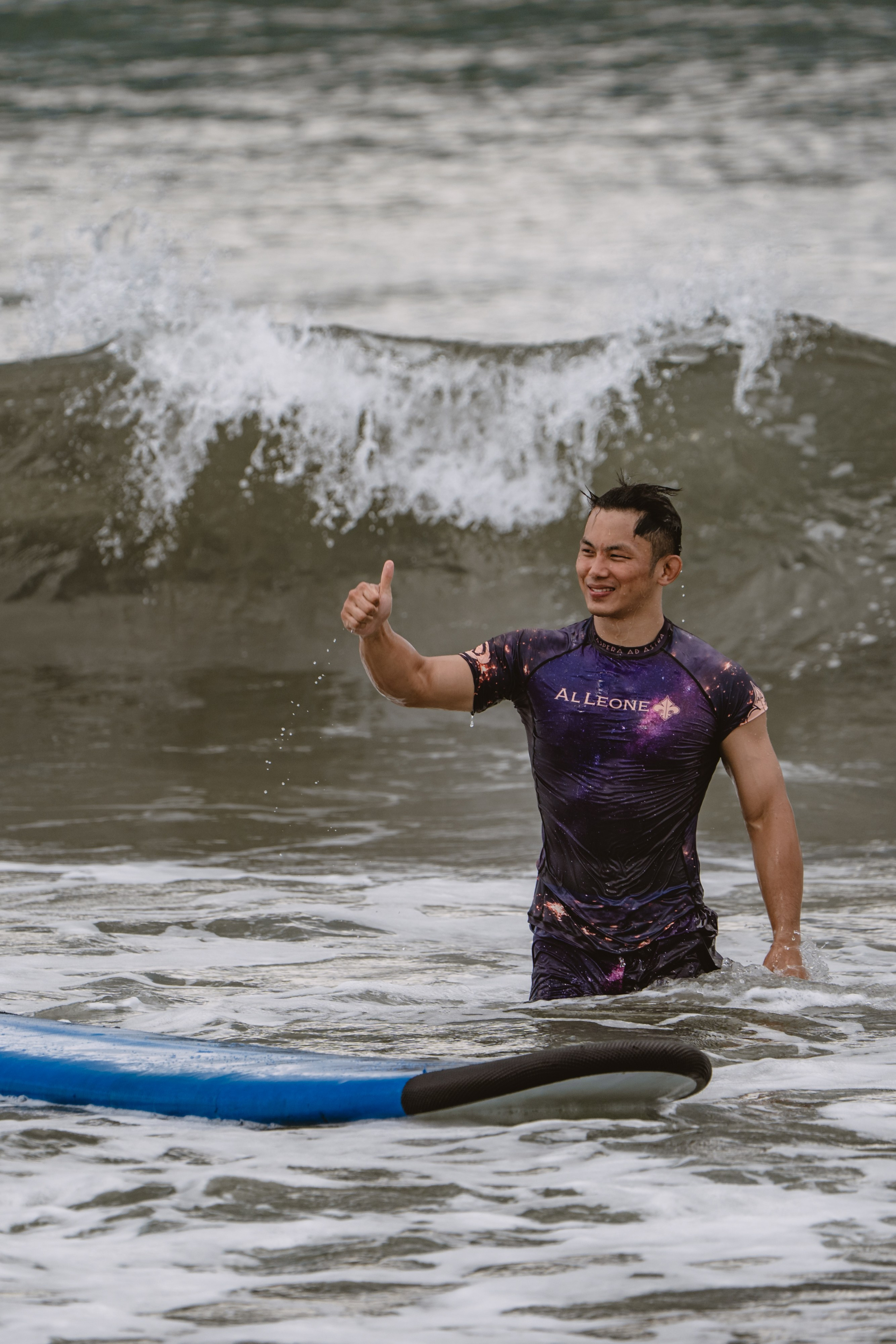 Mixed martial artists having fun surfing at the ocean in between training sessions. Сергей Зворыгин