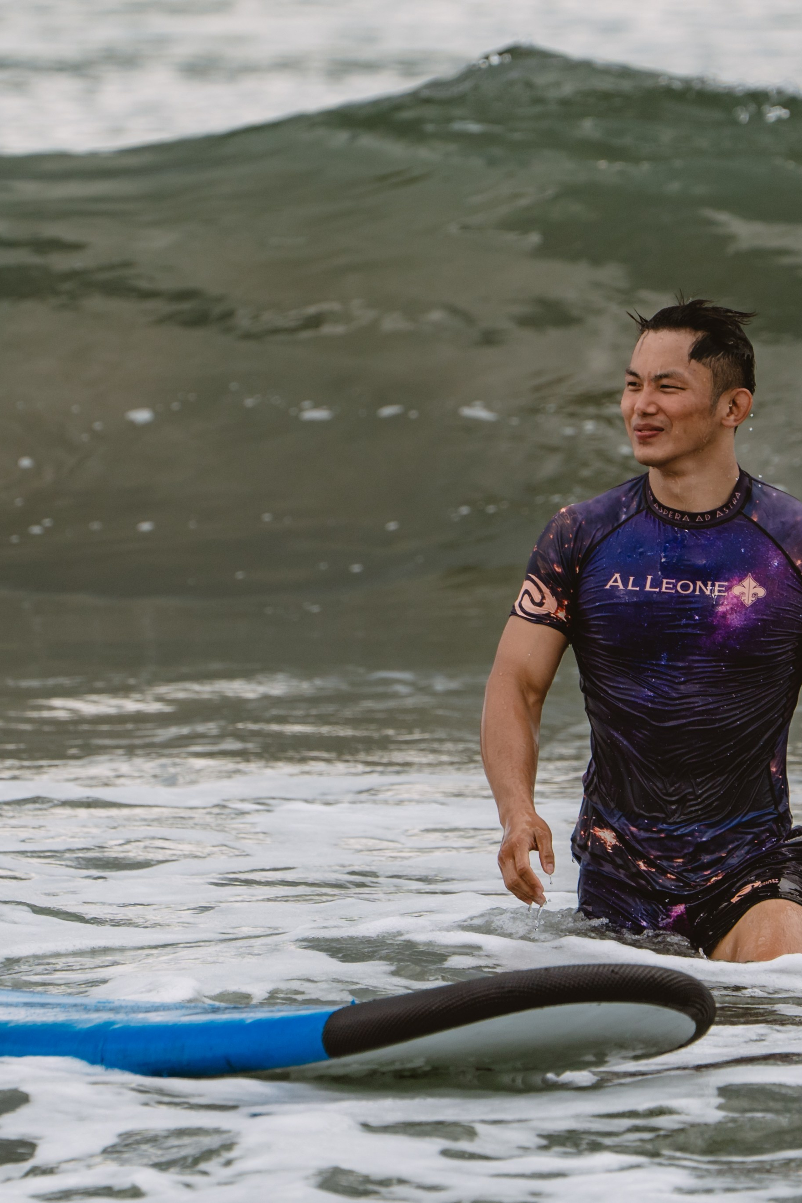 Mixed martial artists having fun surfing at the ocean in between training sessions. Сергей Зворыгин