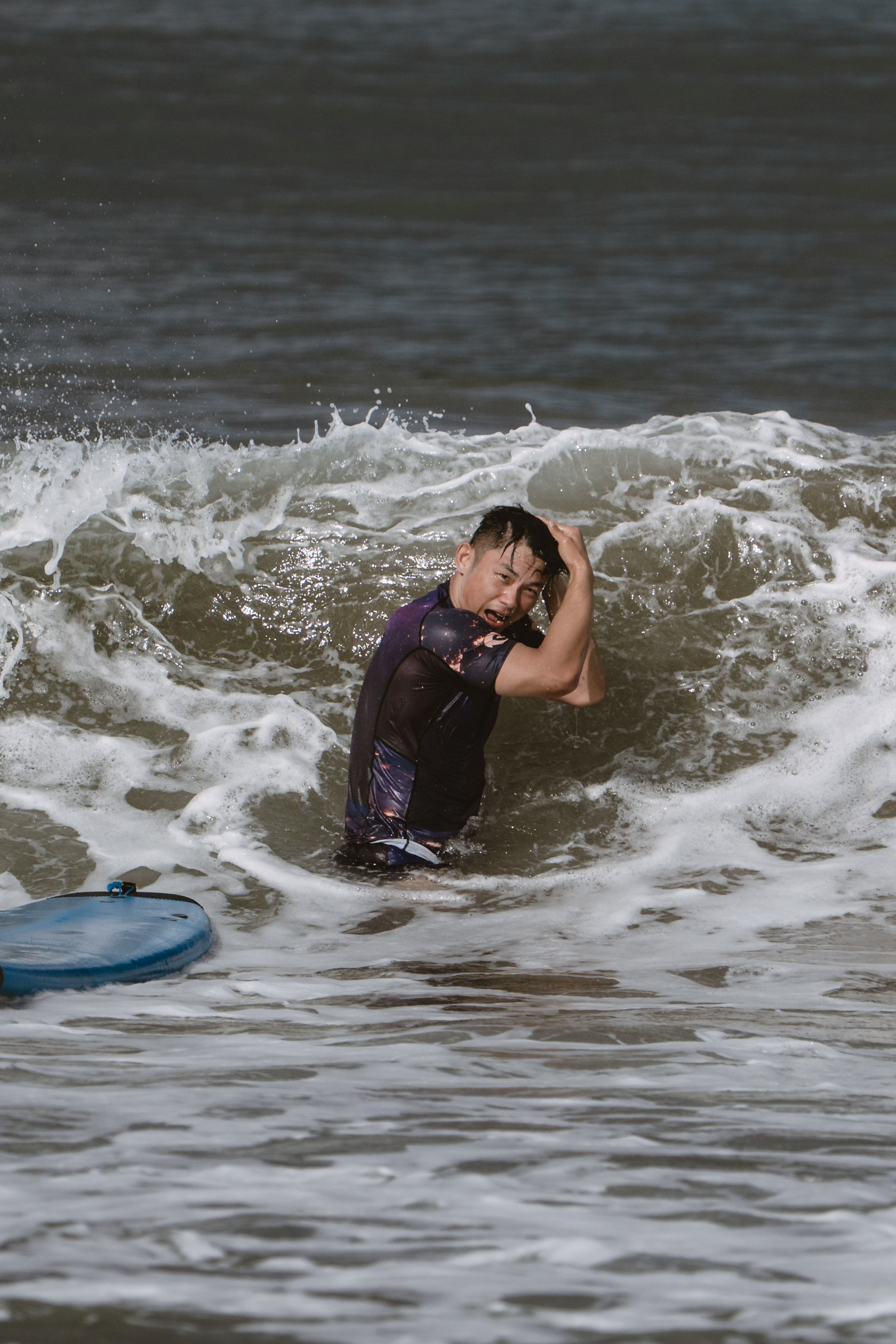 Mixed martial artists having fun surfing at the ocean in between training sessions. Сергей Зворыгин