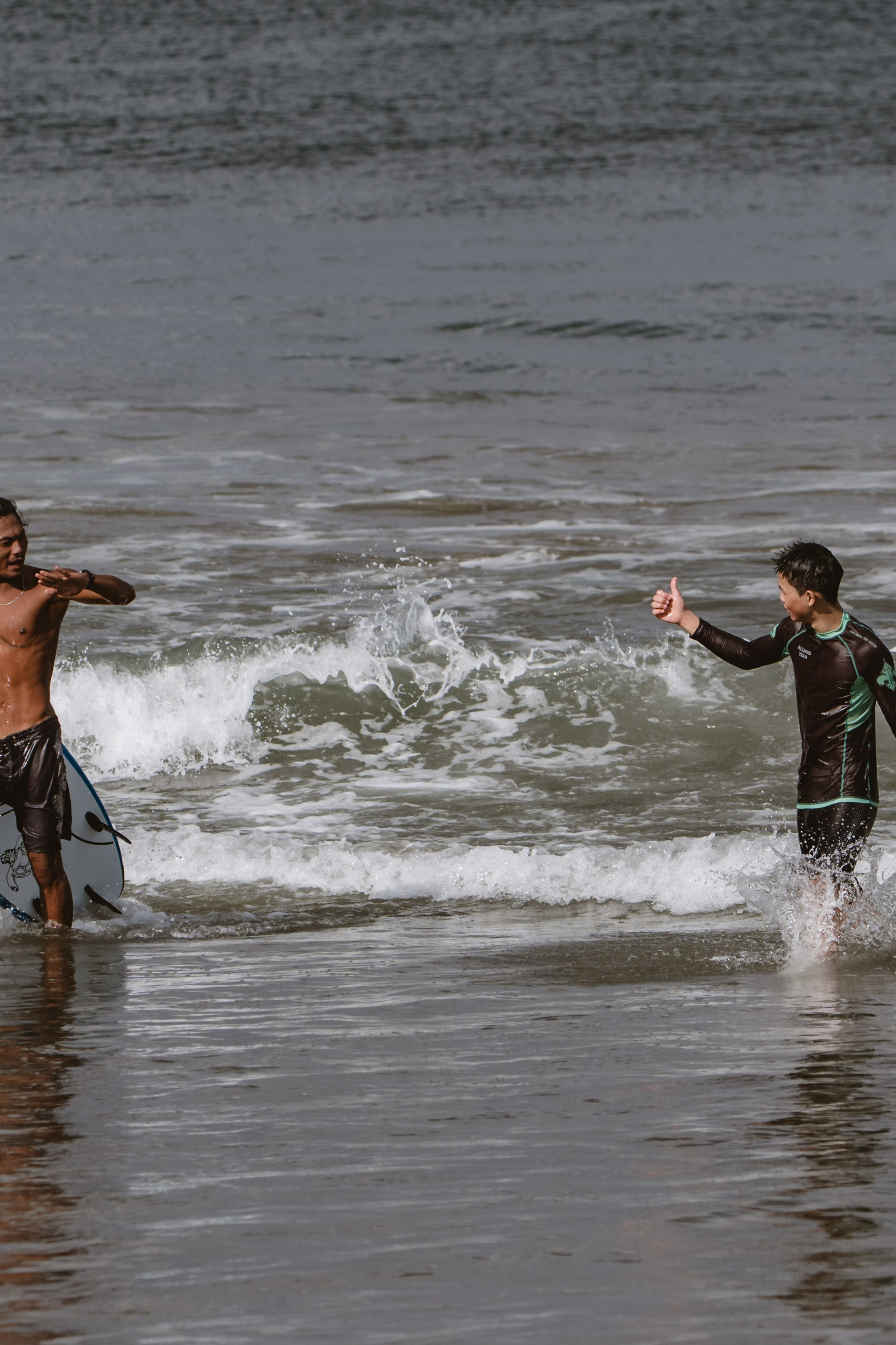 Mixed martial artists having fun surfing at the ocean in between training sessions. Сергей Зворыгин