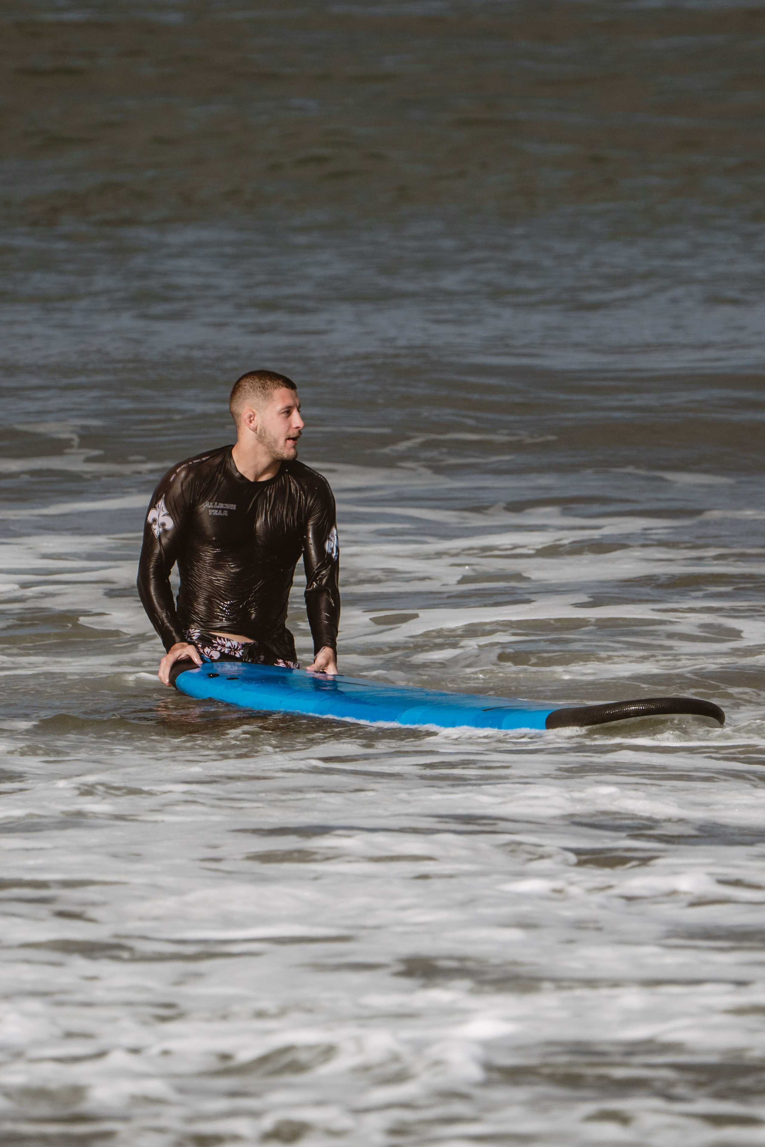 Mixed martial artists having fun surfing at the ocean in between training sessions. Сергей Зворыгин