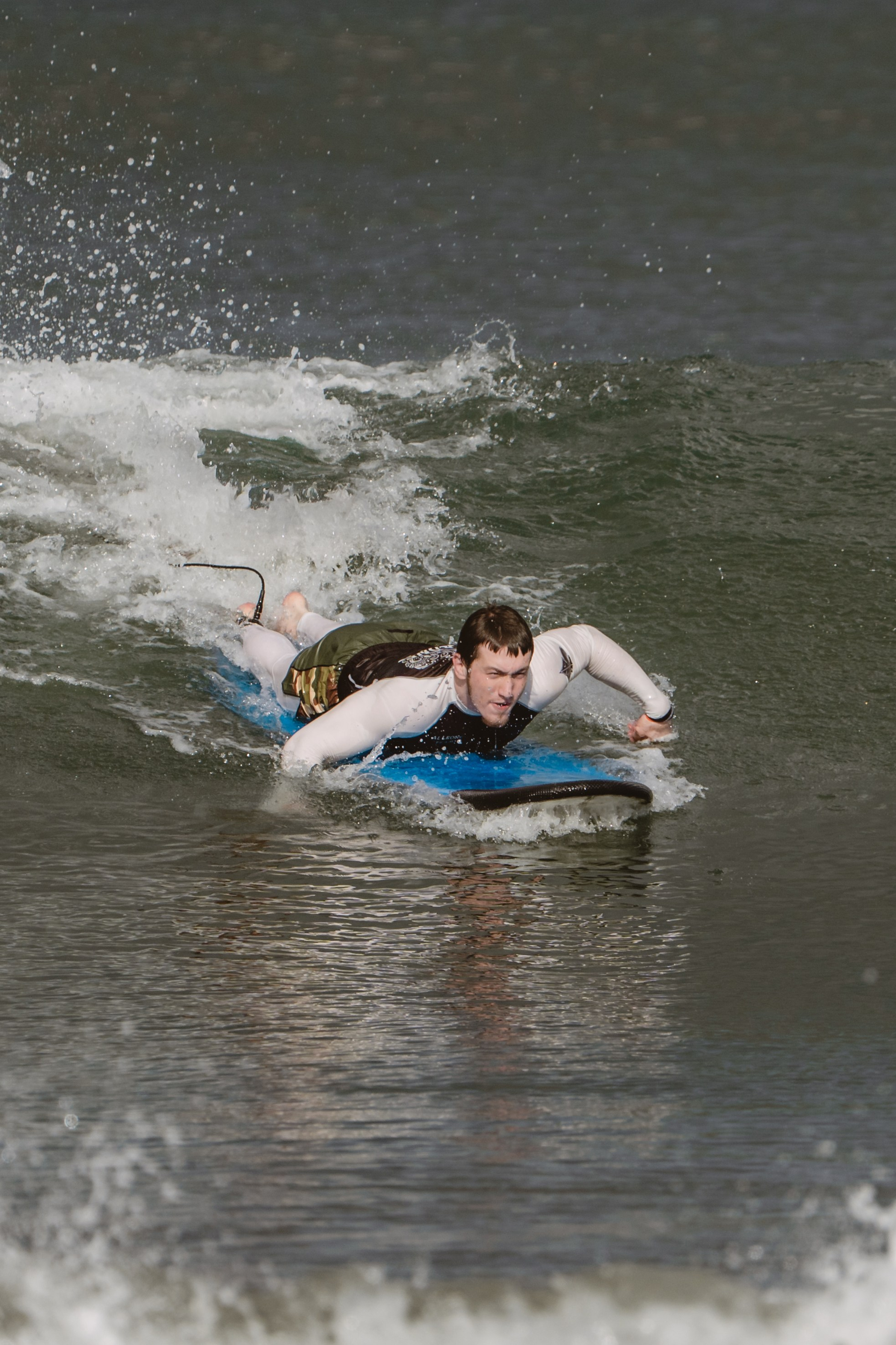 Mixed martial artists having fun surfing at the ocean in between training sessions. Сергей Зворыгин