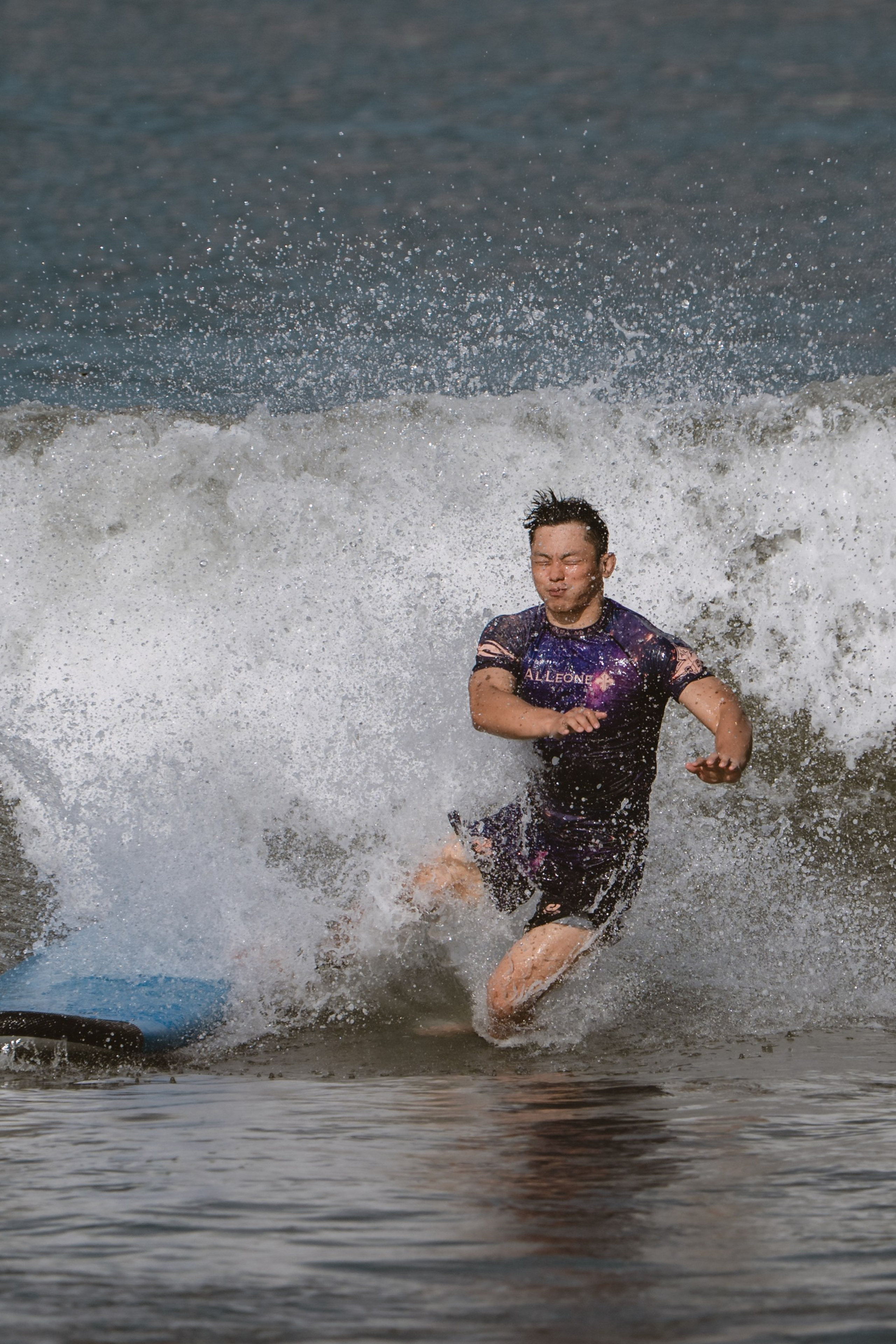 Mixed martial artists having fun surfing at the ocean in between training sessions. Сергей Зворыгин
