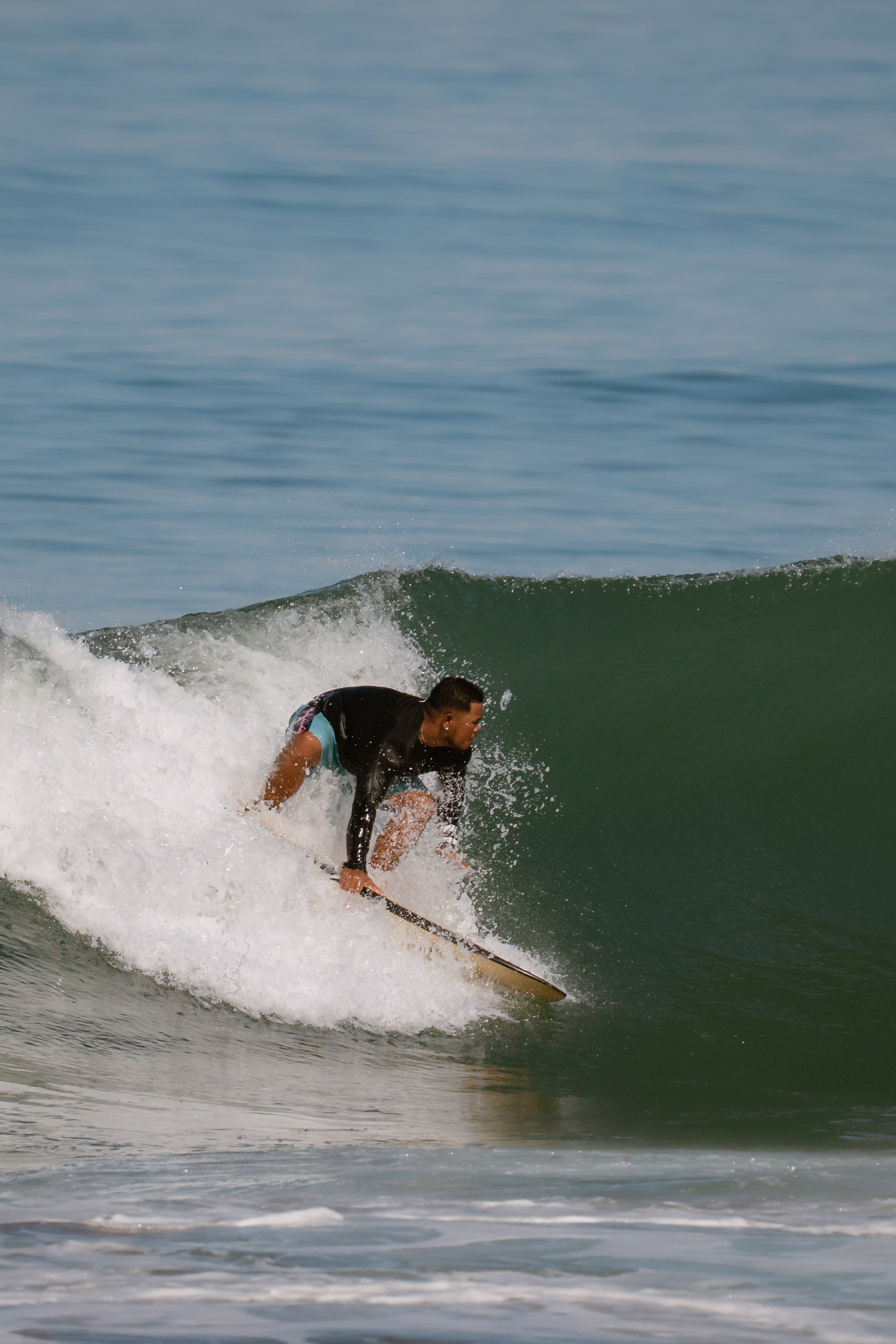 Al Leone athletes having fun surfing in the Pacific Ocean. Сергей Зворыгин