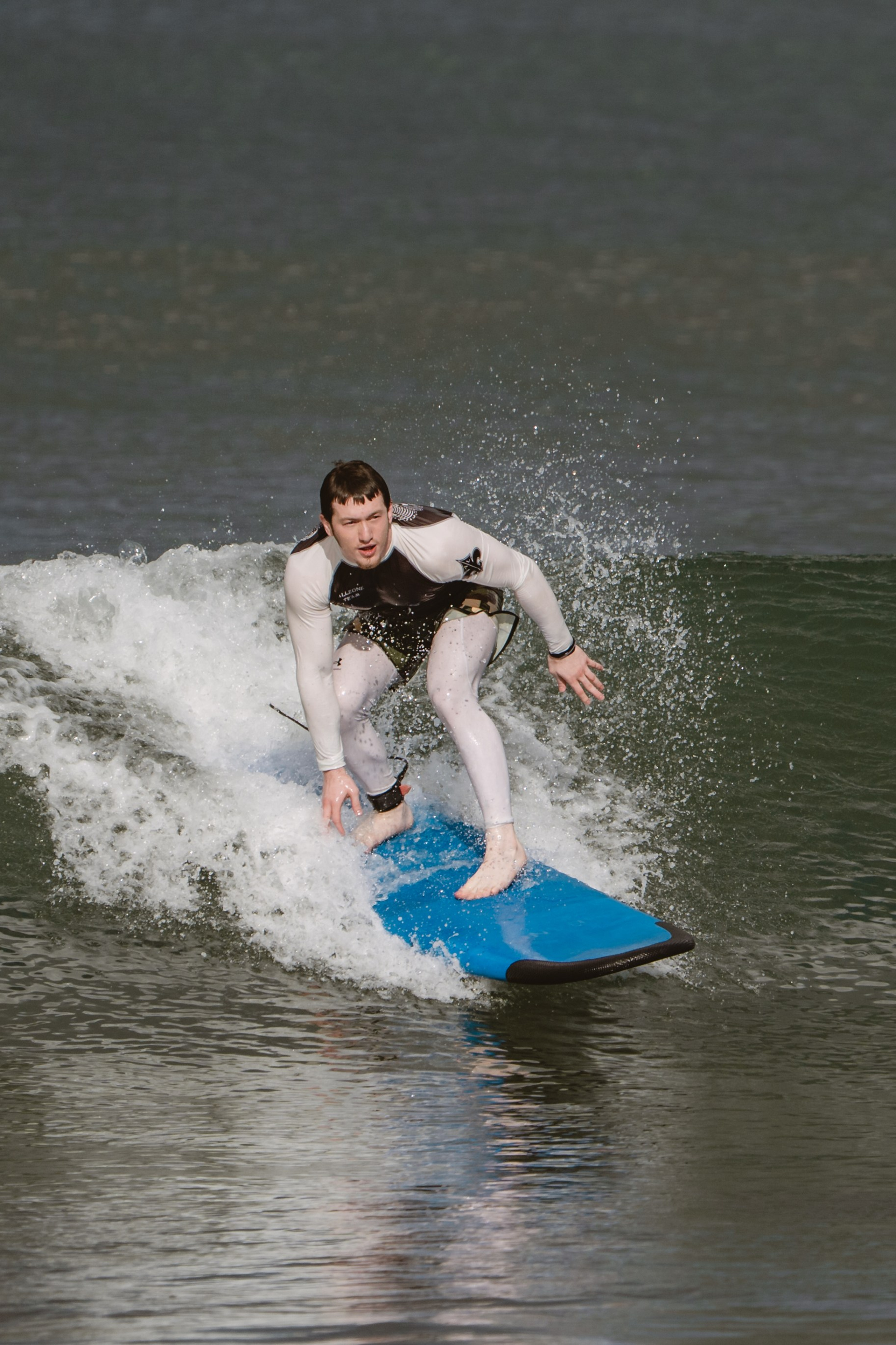 Mixed martial artists having fun surfing at the ocean in between training sessions. Сергей Зворыгин