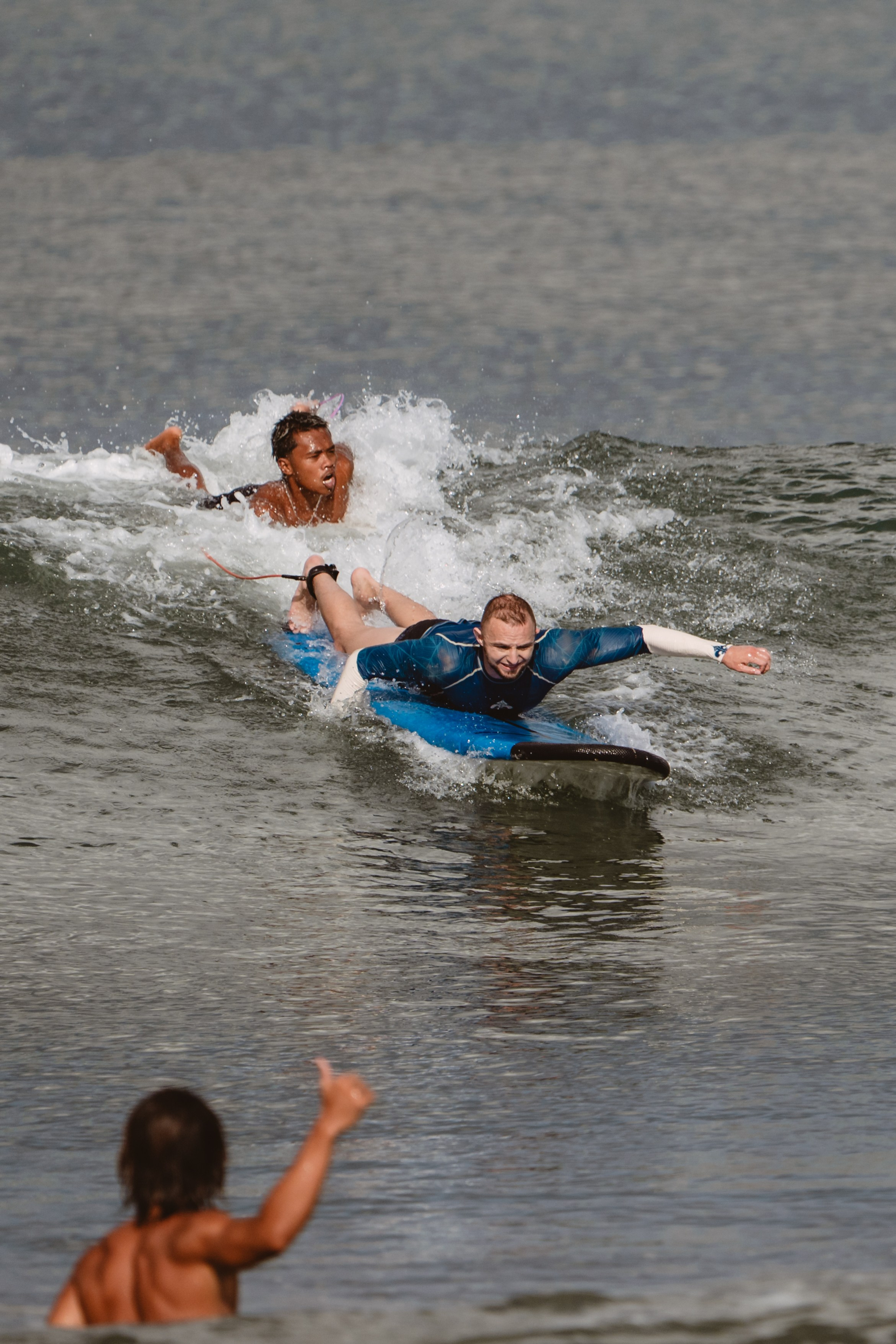 Mixed martial artists having fun surfing at the ocean in between training sessions. Сергей Зворыгин