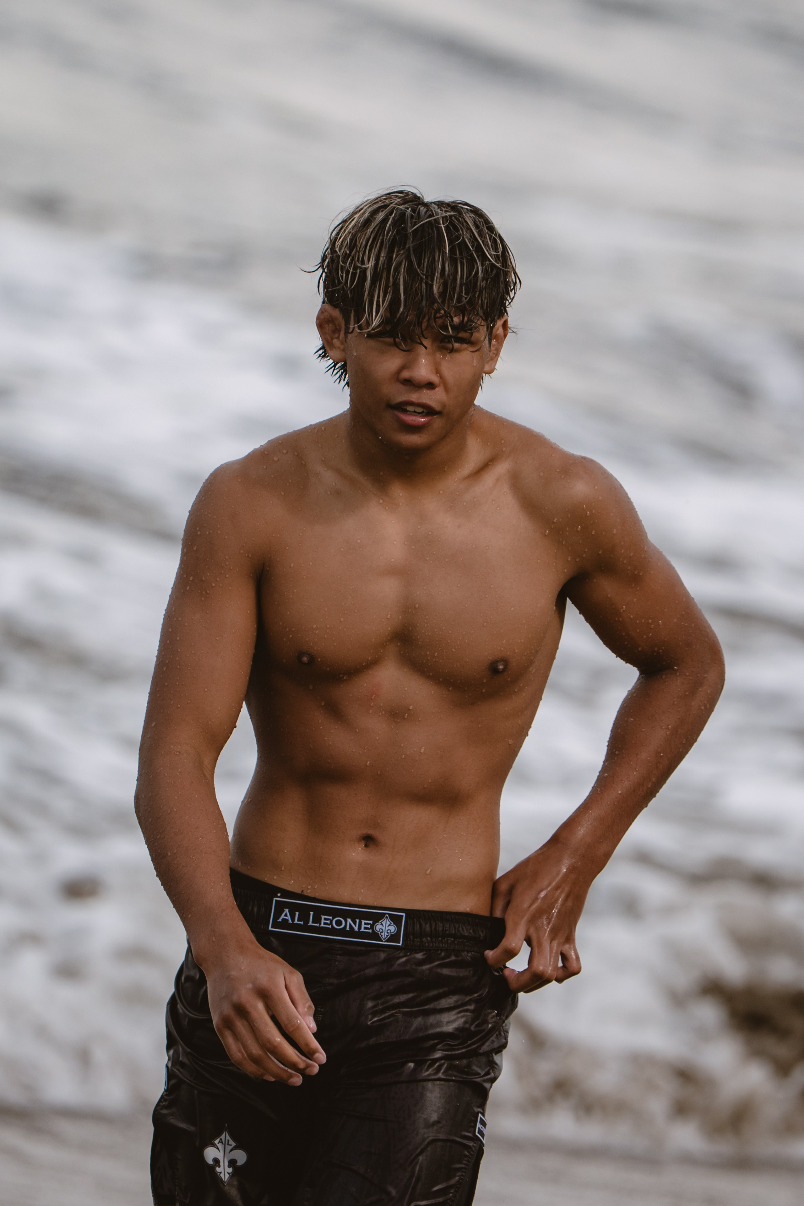 Mixed martial artists having fun surfing at the ocean in between training sessions. Сергей Зворыгин