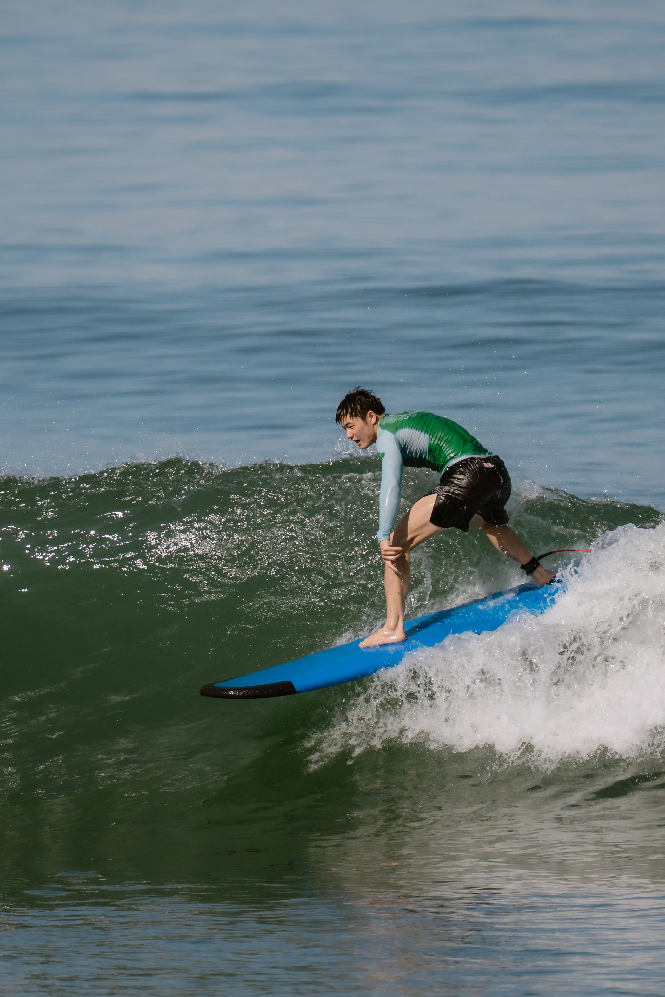 Al Leone athletes having fun surfing in the Pacific Ocean. Сергей Зворыгин