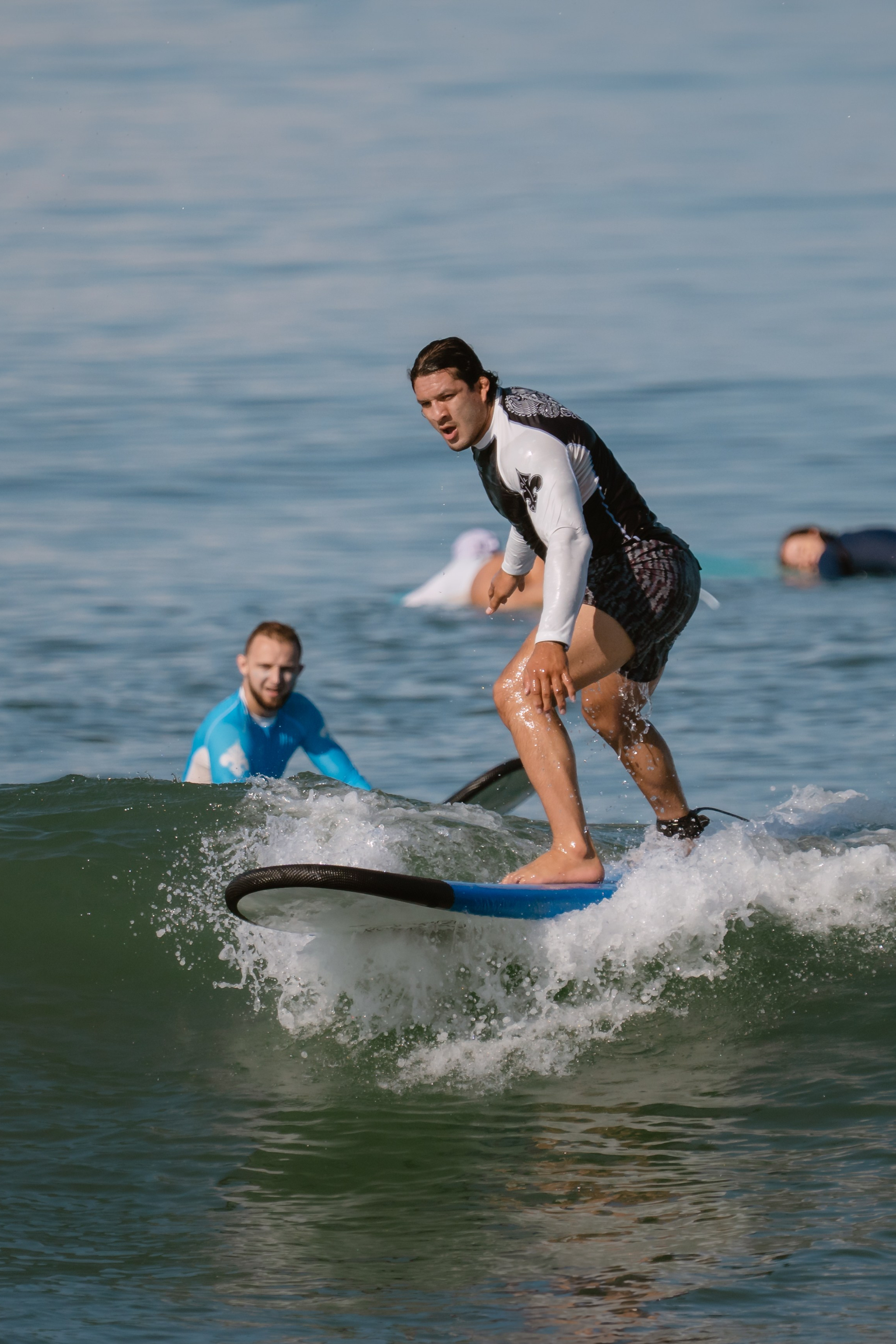 Al Leone athletes having fun surfing in the Pacific Ocean. Сергей Зворыгин