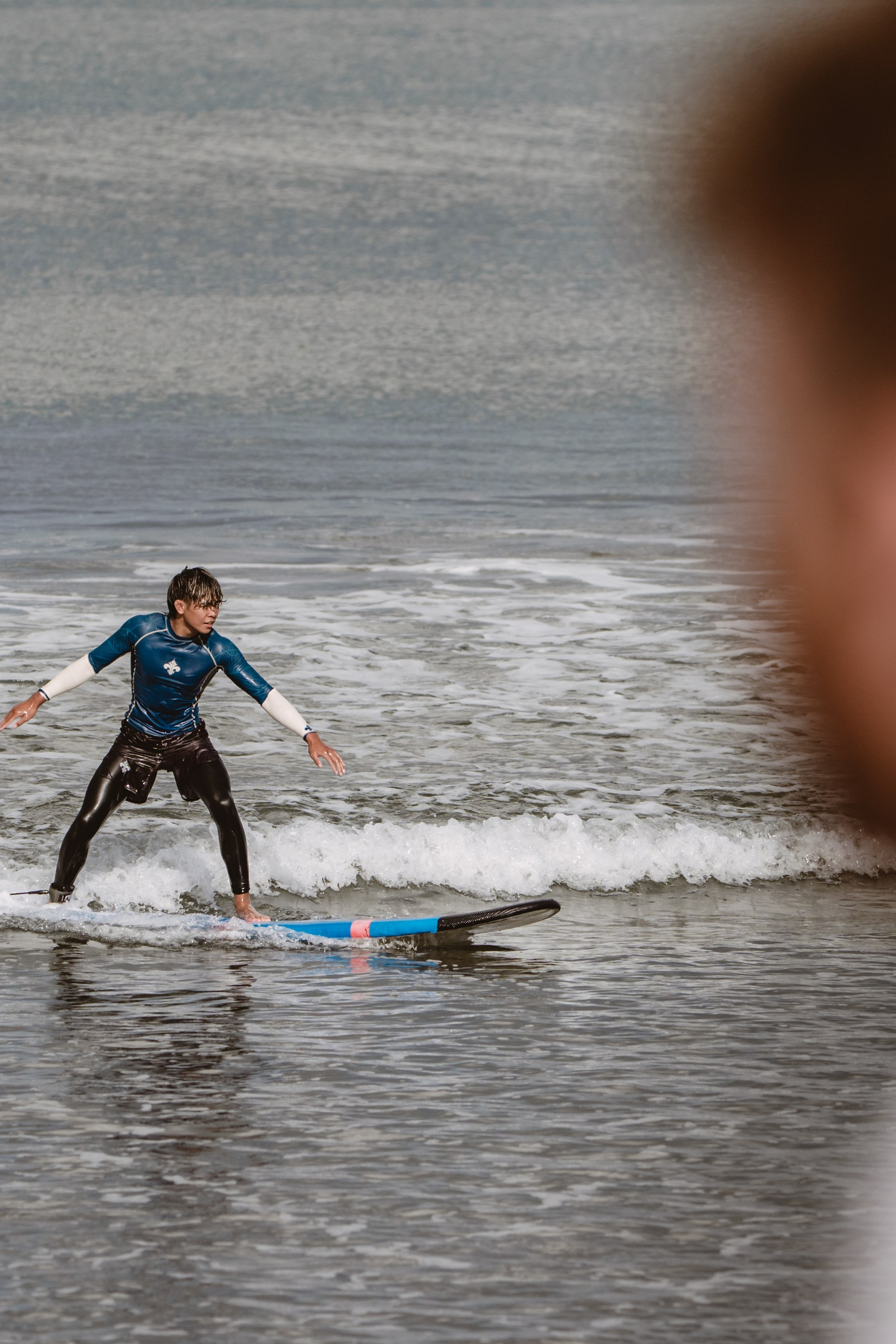 Mixed martial artists having fun surfing at the ocean in between training sessions. Сергей Зворыгин
