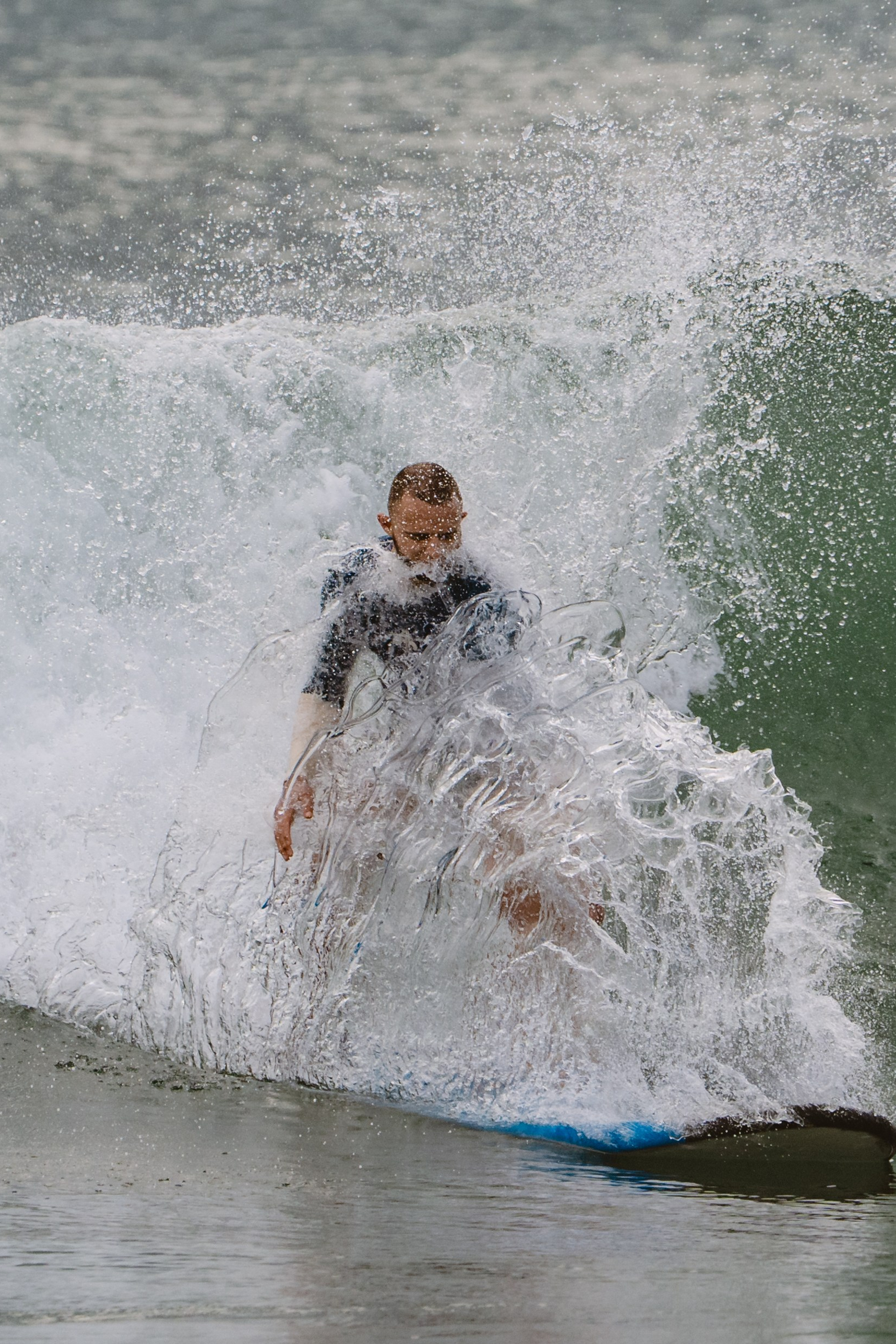 Mixed martial artists having fun surfing at the ocean in between training sessions. Сергей Зворыгин