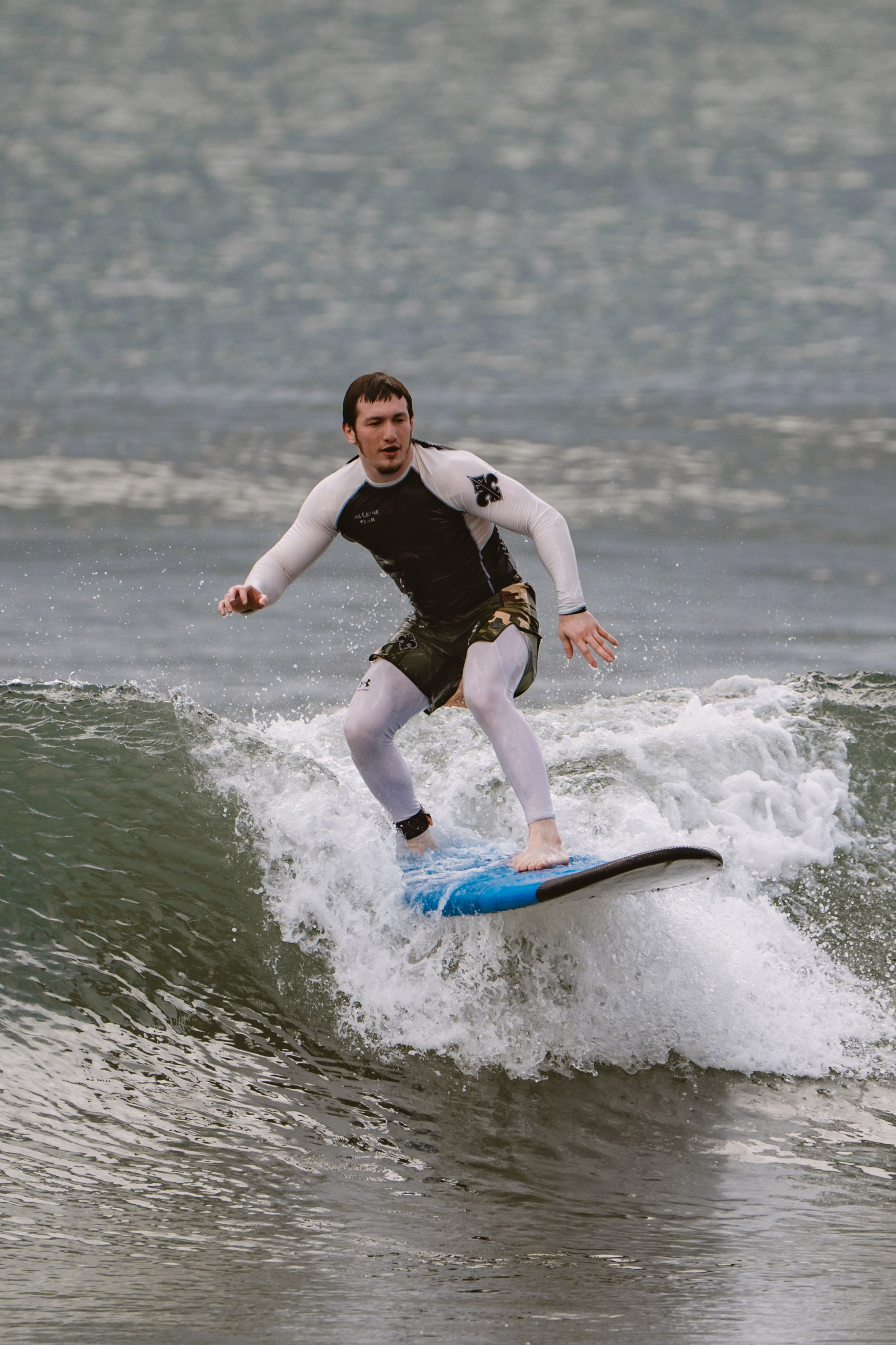 Mixed martial artists having fun surfing at the ocean in between training sessions. Сергей Зворыгин