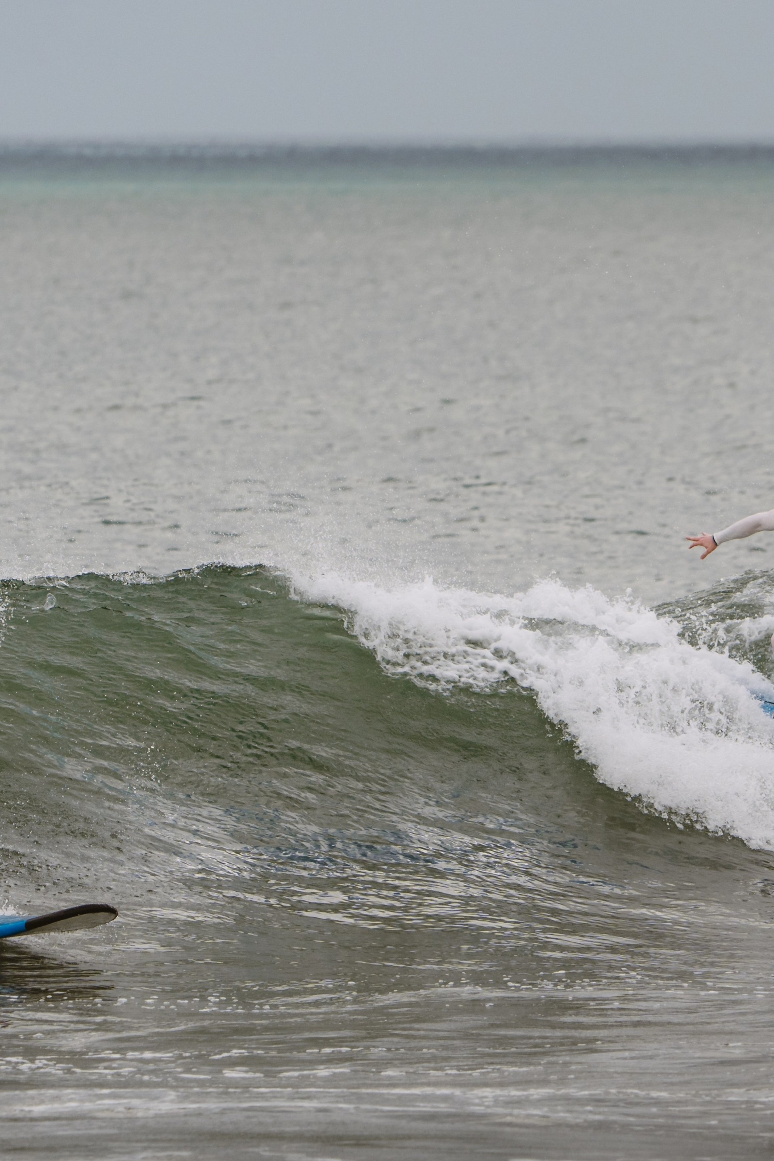 Mixed martial artists having fun surfing at the ocean in between training sessions. Сергей Зворыгин