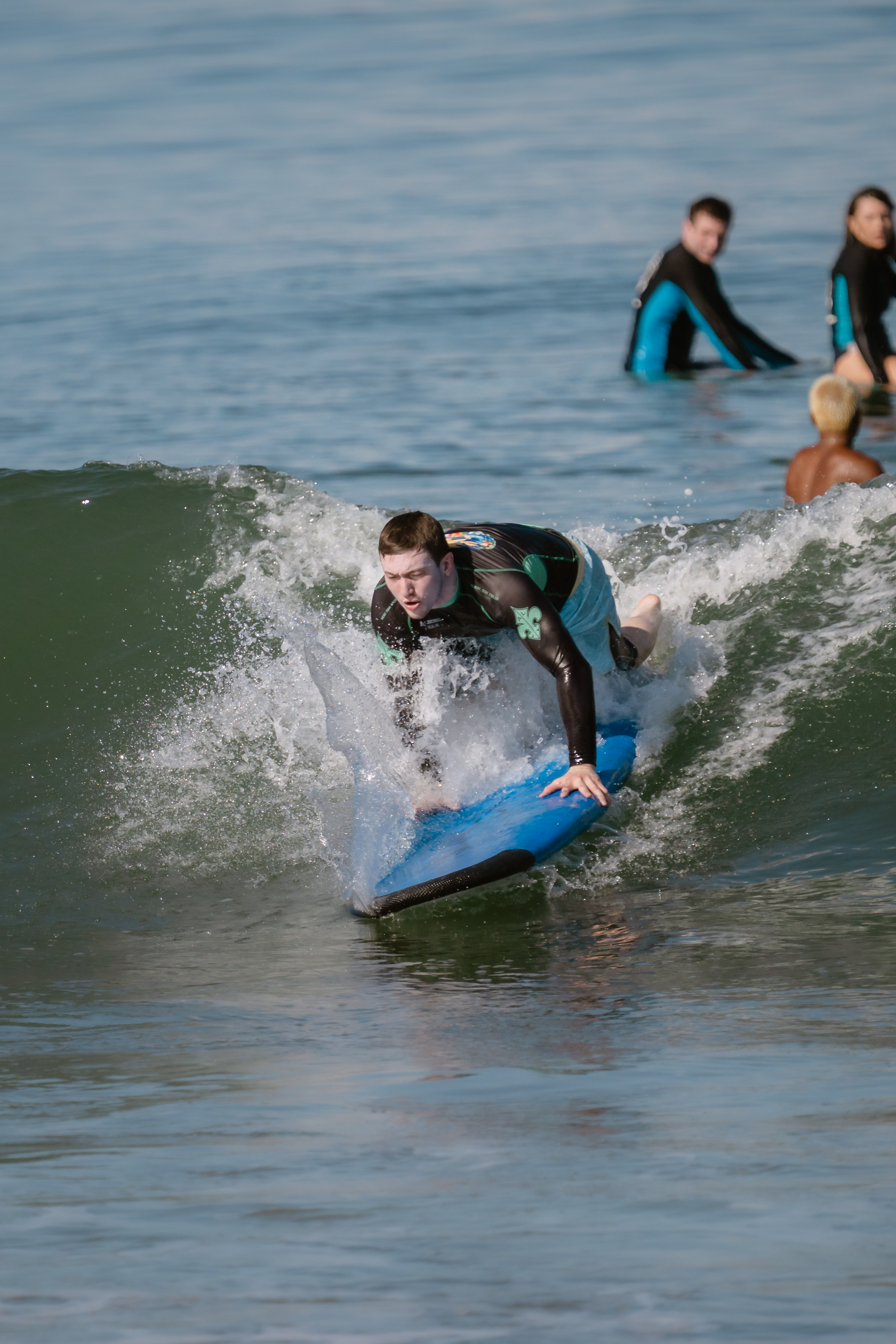 Al Leone athletes having fun surfing in the Pacific Ocean. Сергей Зворыгин