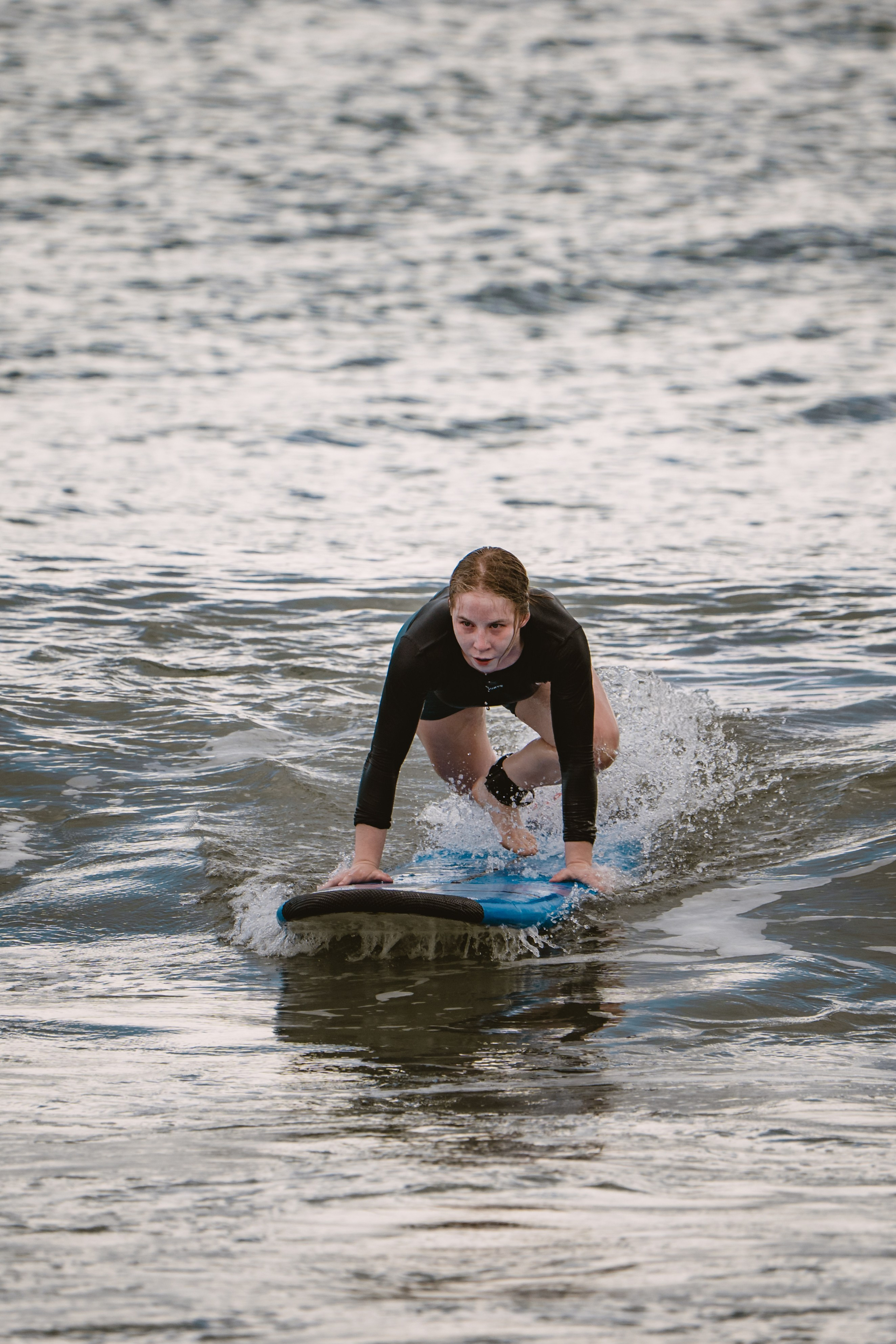 Mixed martial artists having fun surfing at the ocean in between training sessions. Сергей Зворыгин