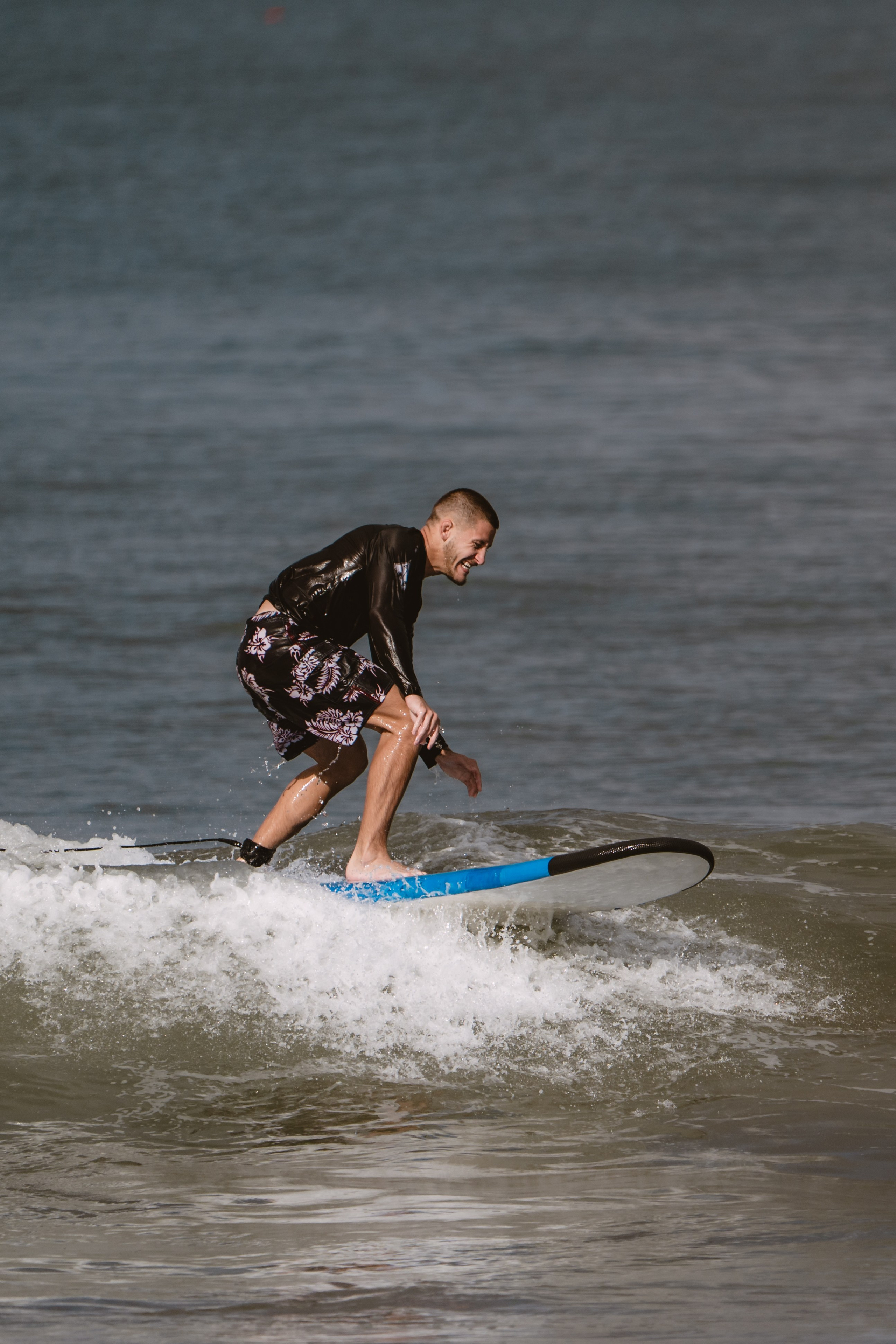Mixed martial artists having fun surfing at the ocean in between training sessions. Сергей Зворыгин