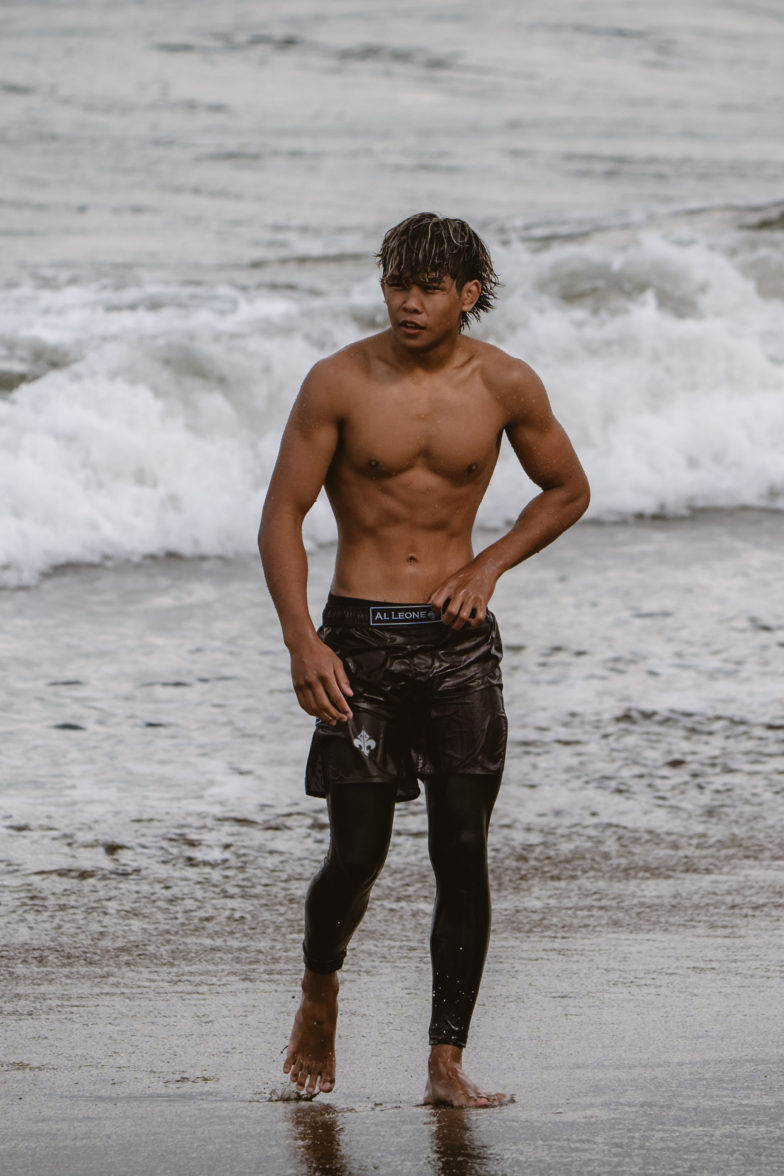 Mixed martial artists having fun surfing at the ocean in between training sessions. Сергей Зворыгин