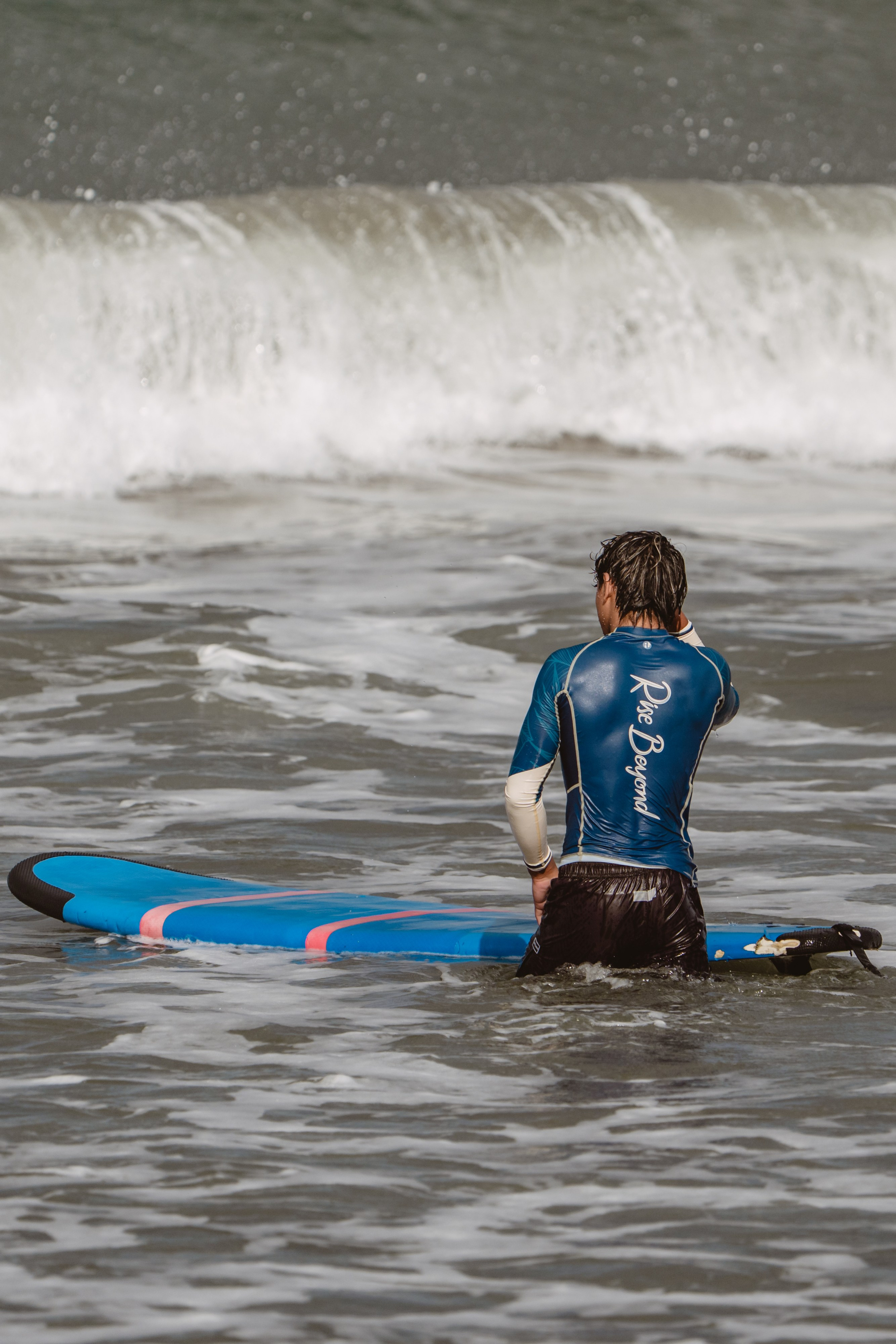 Mixed martial artists having fun surfing at the ocean in between training sessions. Сергей Зворыгин
